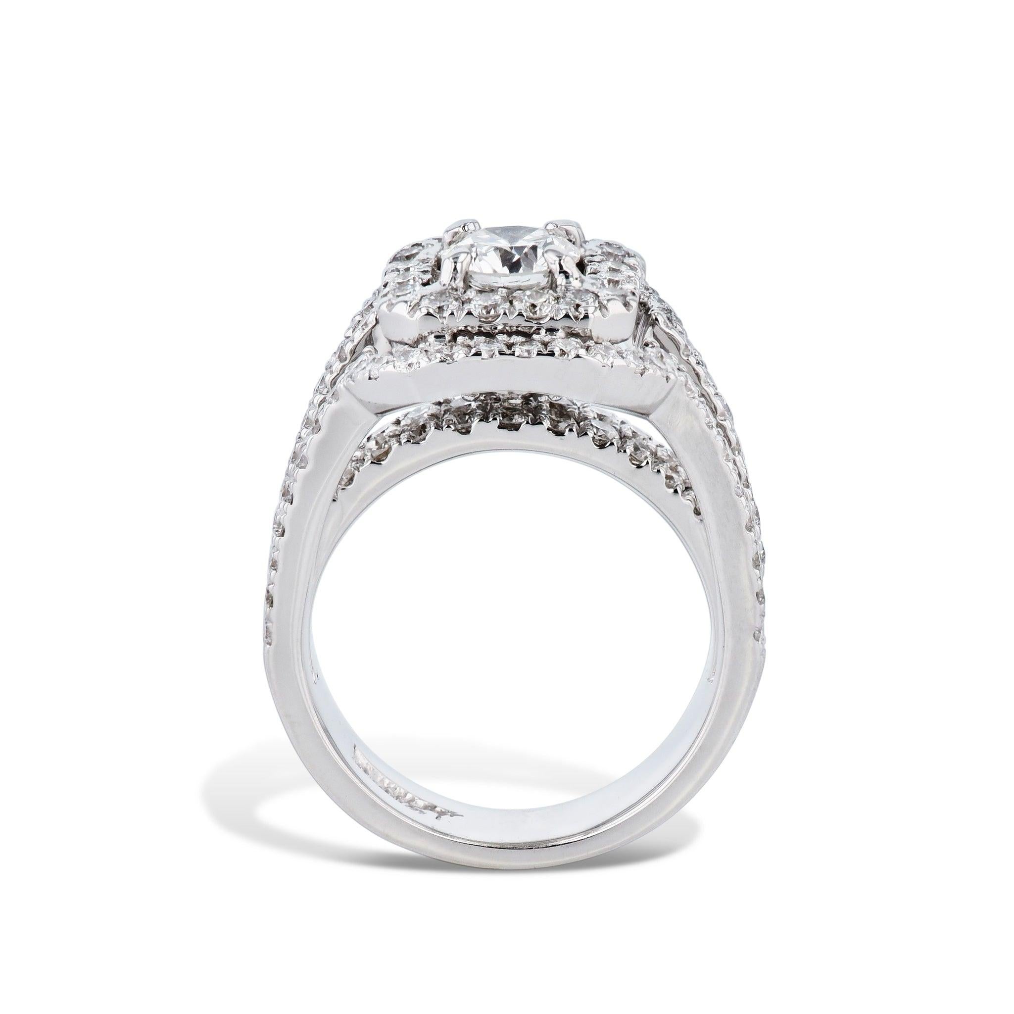 A beautiful 18kt white gold estate ring, showcasing an impressive round diamond at its center. A further 122 diamonds, Pave set around the center stone and along the shank, make this a true showstopper! With a size of 4.5 it is perfect for making a