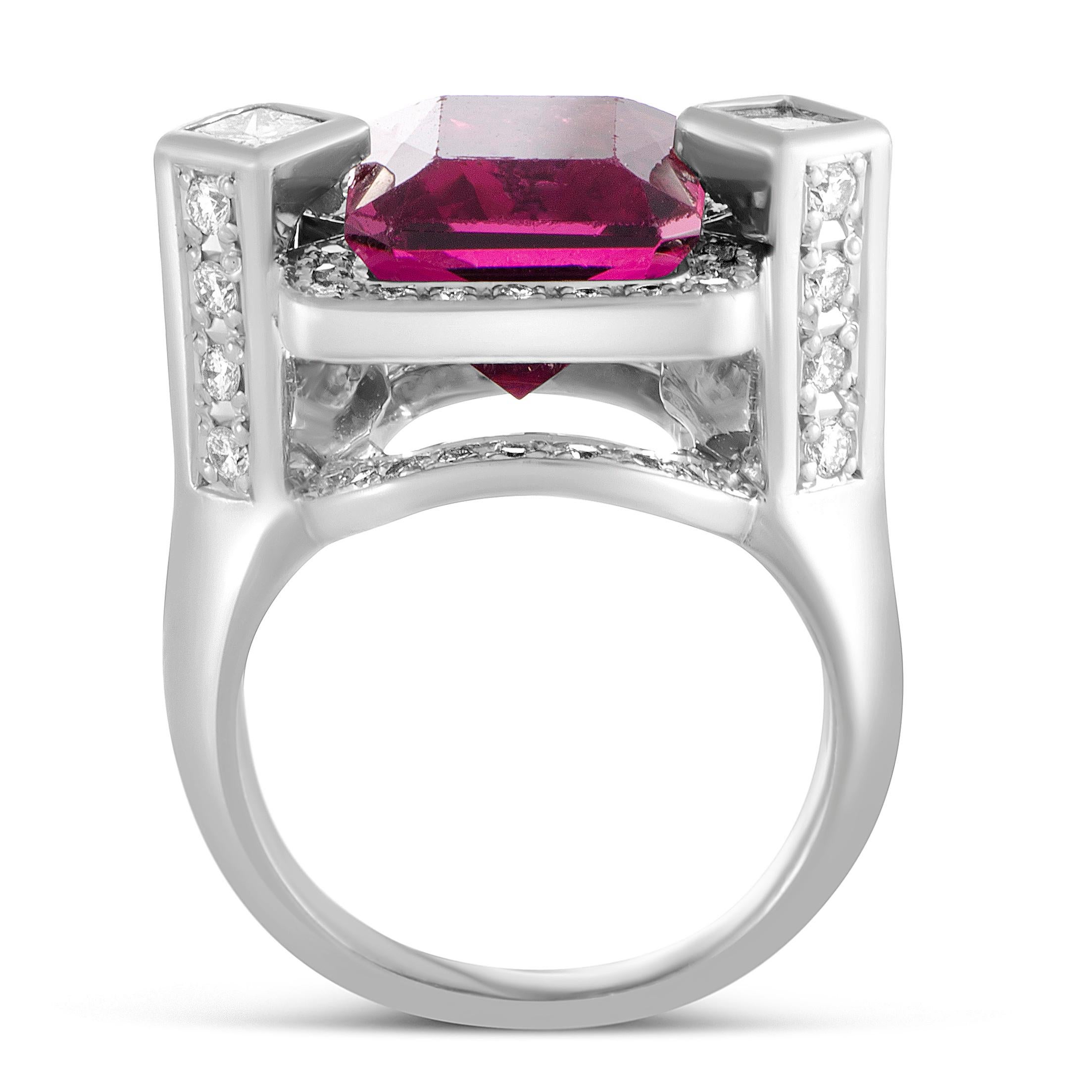 The scintillating luster of diamonds wonderfully brings out the regal beauty of the pink tourmaline in this compelling platinum ring that boasts attractive design and superb craftsmanship quality. The tourmaline weighs 6.96 carats and the diamonds