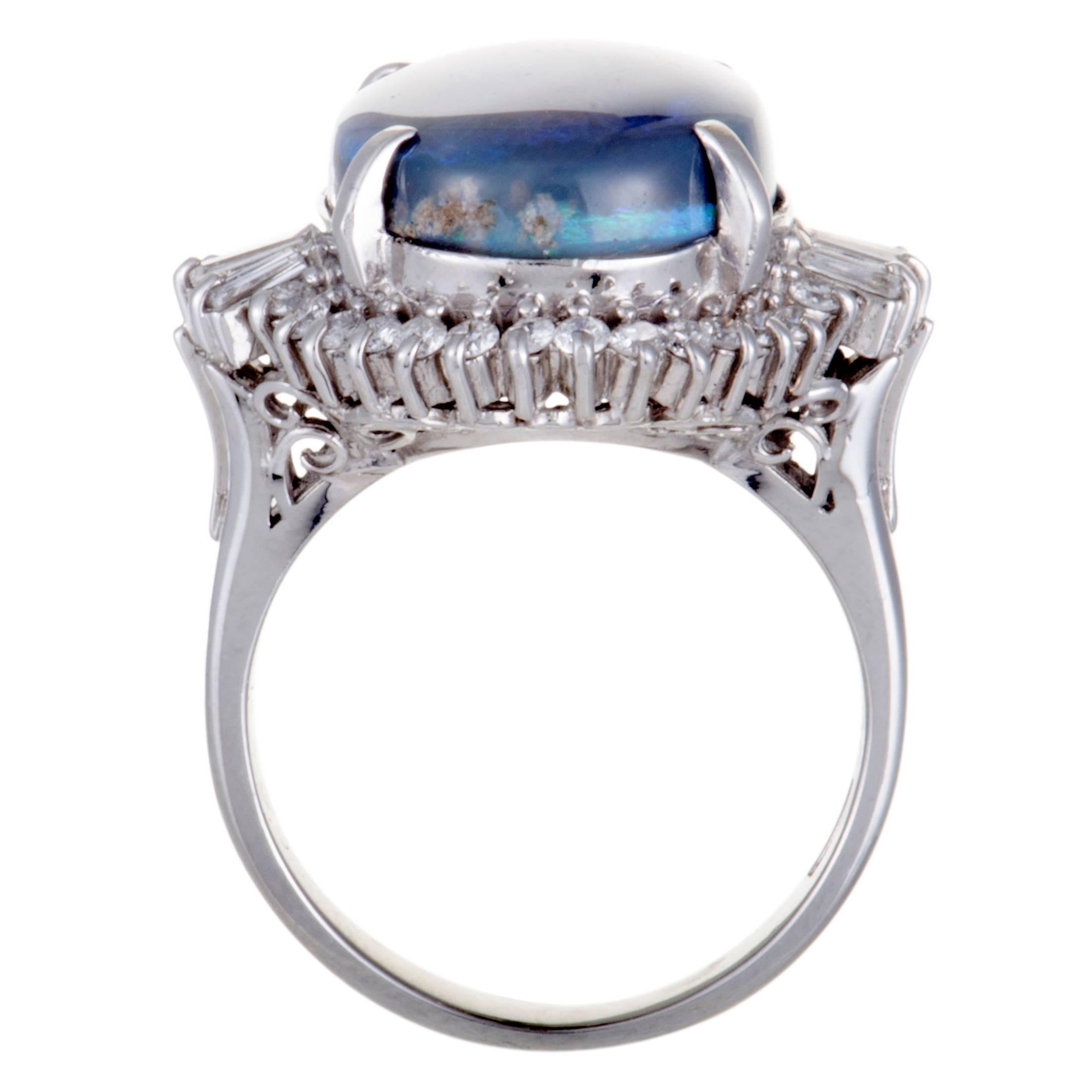 The eye-catching milky blue opal takes the central place in this ravishing platinum ring and is accentuated in the most luxurious manner by incredibly glistening and diversely cut diamond stones. The diamonds amount to 1.25 carats and the opal