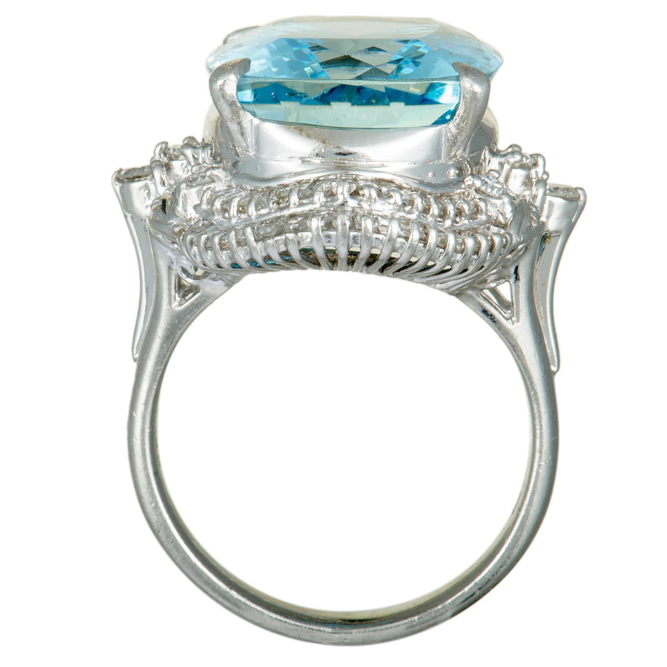 Elevate your style in an endearingly luxurious fashion with this gorgeous platinum ring that boasts a splendidly classy design topped off with sublime gems. The ring is set with a total of 0.86 carats of diamonds and with an expertly cut aquamarine