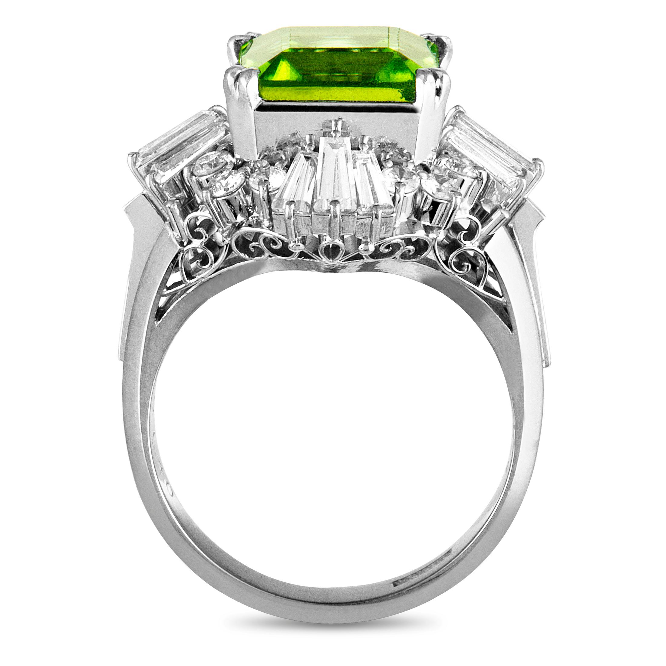 The intriguing allure of the peridot is enhanced by the scintillating diamond resplendence in this ravishing ring that is beautifully made of elegant platinum. The peridot weighs 5.55 carats and the diamonds amount to 1.40 carats.
Ring Size: