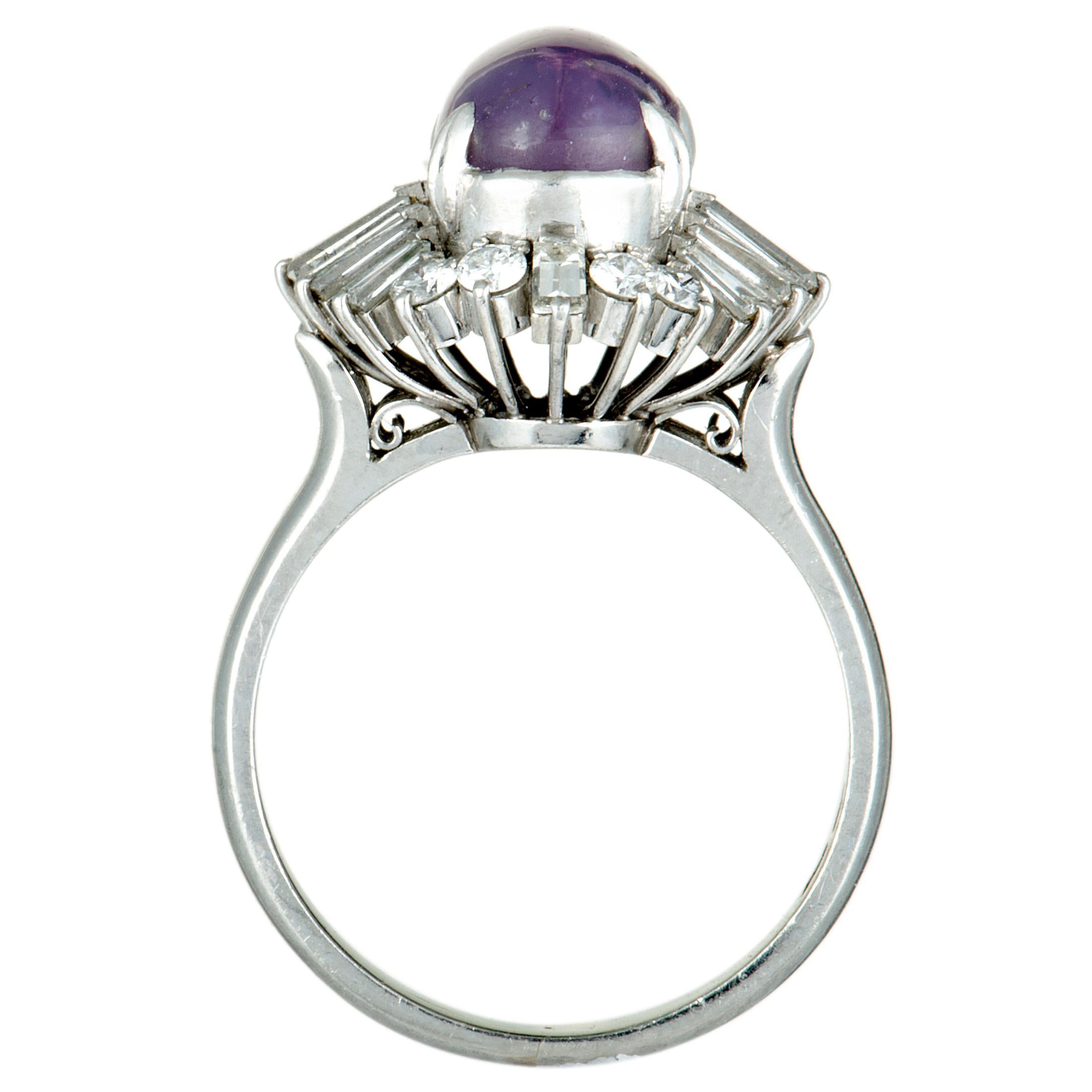 The sublime beauty of the purple sapphire is splendidly brought out by the prestigious platinum and the resplendent diamonds in this wonderful jewelry piece. The ring is set with a total of 0.96 carats of diversely cut diamond stones, while the