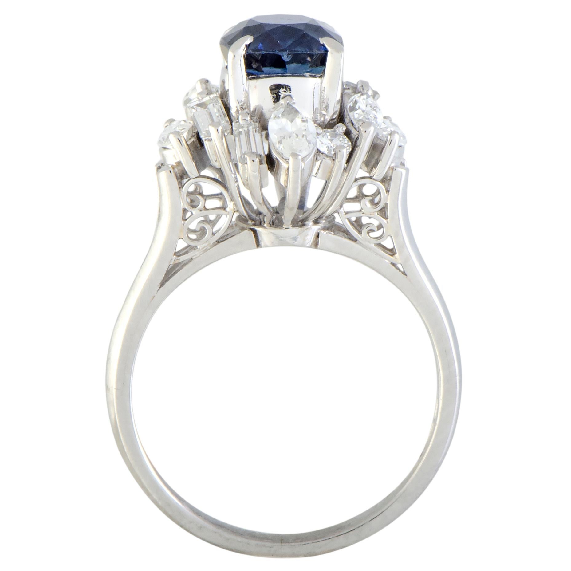 The expertly cut sapphire gives a compellingly regal appeal to this magnificent platinum ring that will elevate your style in a most refined fashion. The sapphire weighs 1.40 carats and it is accentuated by resplendent, diversely cut diamond stones