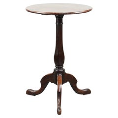Round antique side/wine table from the late 18th century with a subtle foot