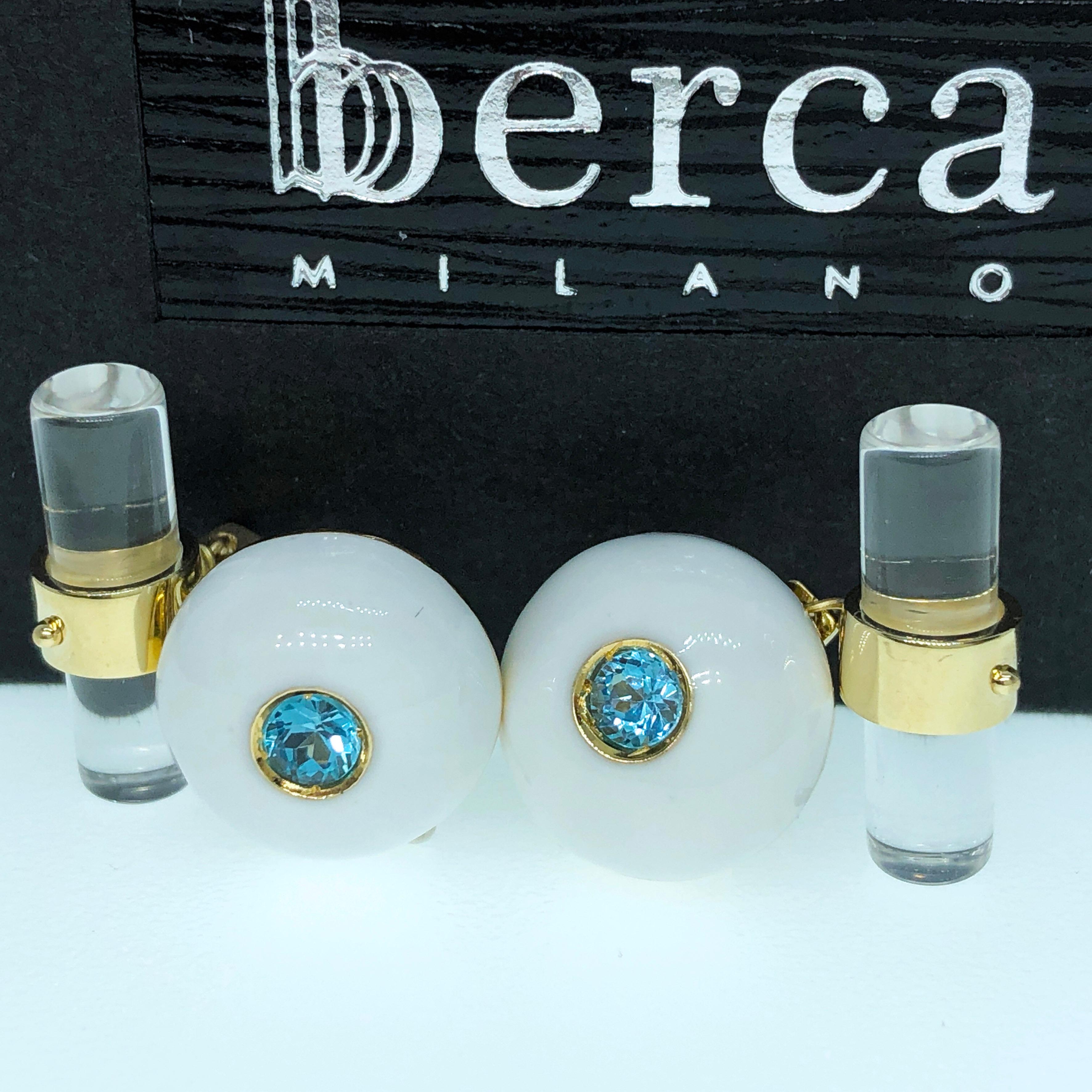 Chic and Timeless 0.45 Carat Natural Brilliant Cut Aquamarine in a White Hand Enameled Round Cabochon Yellow Gold Setting, Hand Inlaid Rock Crystal Baton back.
In our Smart Black Box.
We Offer 24 Hours Express Shipping to Several Destinations.
