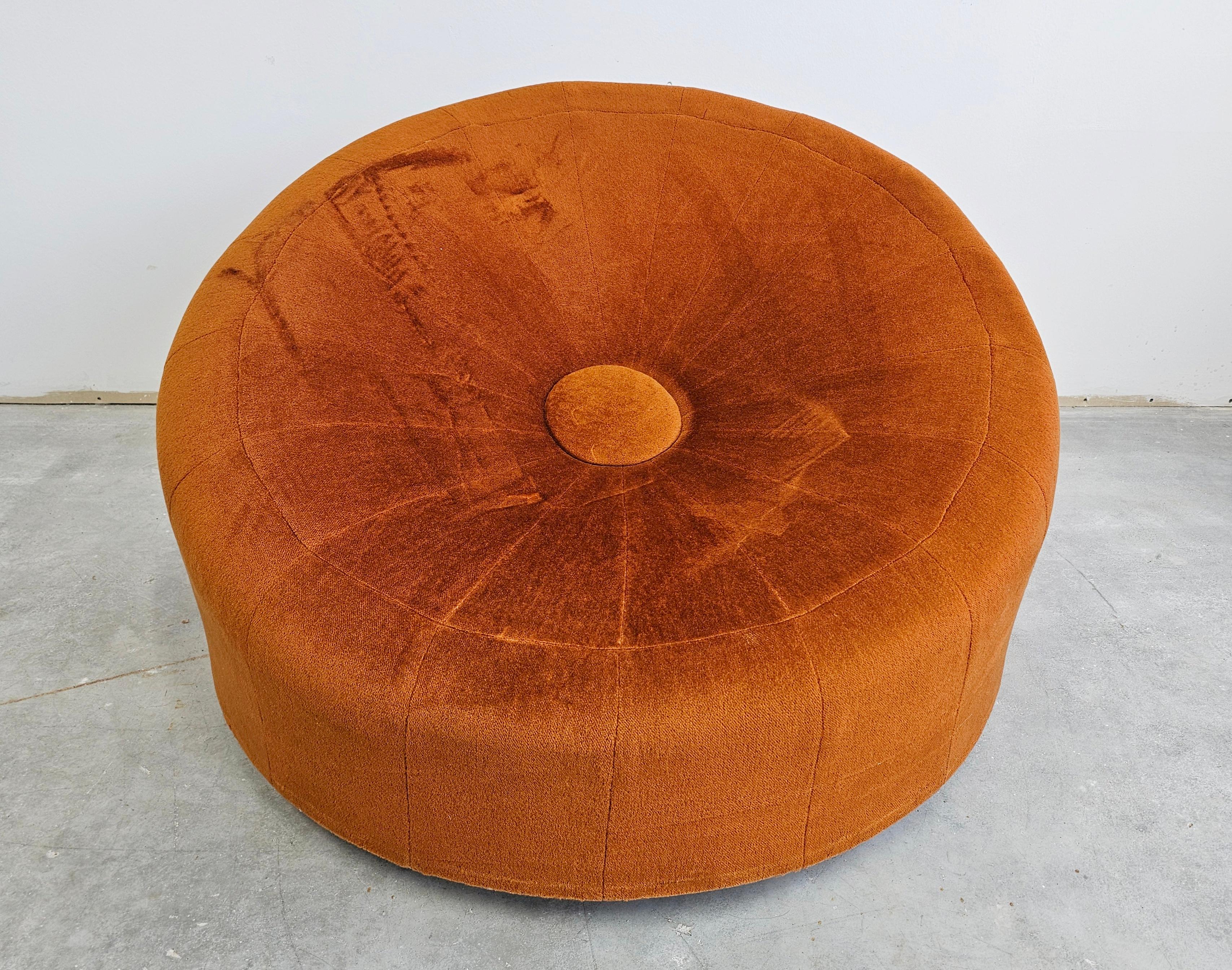 In this listing you will find an exceptionally rare Mid Century Modern Circular Armchair designed as an oversized pouf, in style of Pierre Paulin. The armchair features round design with a large button-like detail in its center. It is very