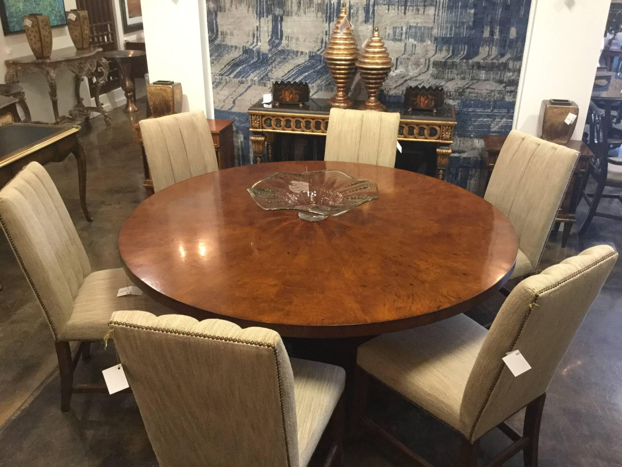 Classic dining table featuring Italian burl walnut veneered pie shaped top with Art Deco style base. Handcrafted artisan design featuring a slight distressed finish, Italy.