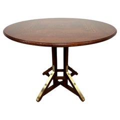 Round art deco dining table with brass