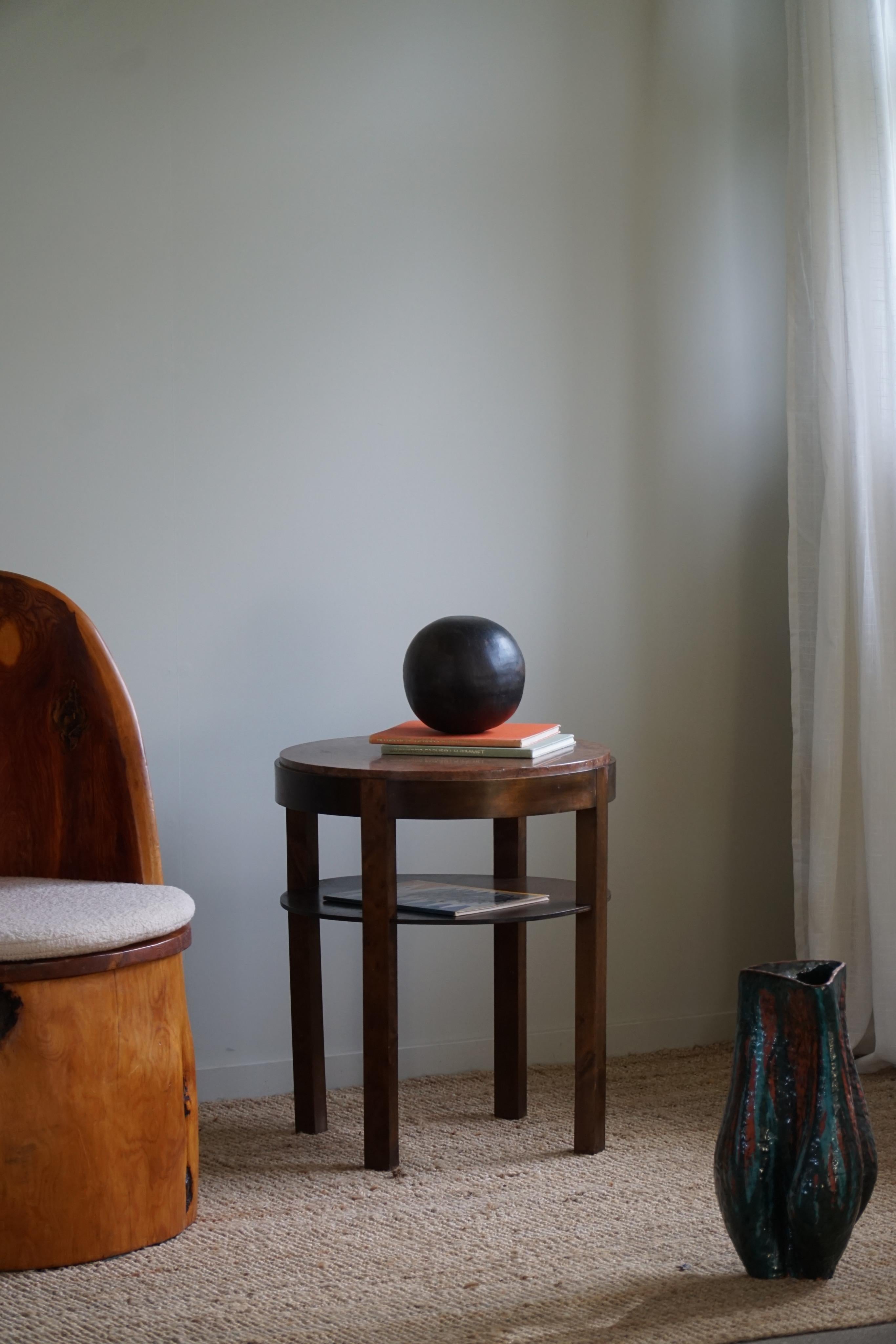 An elegant Art Deco side table / pedestal in beech with an exclusive marble top. Made by a Danish Cabinetmaker in 1940s.

This charming vintage table will complement many interior styles. A modern, antique, classic, Scandinavian or an Art Deco home