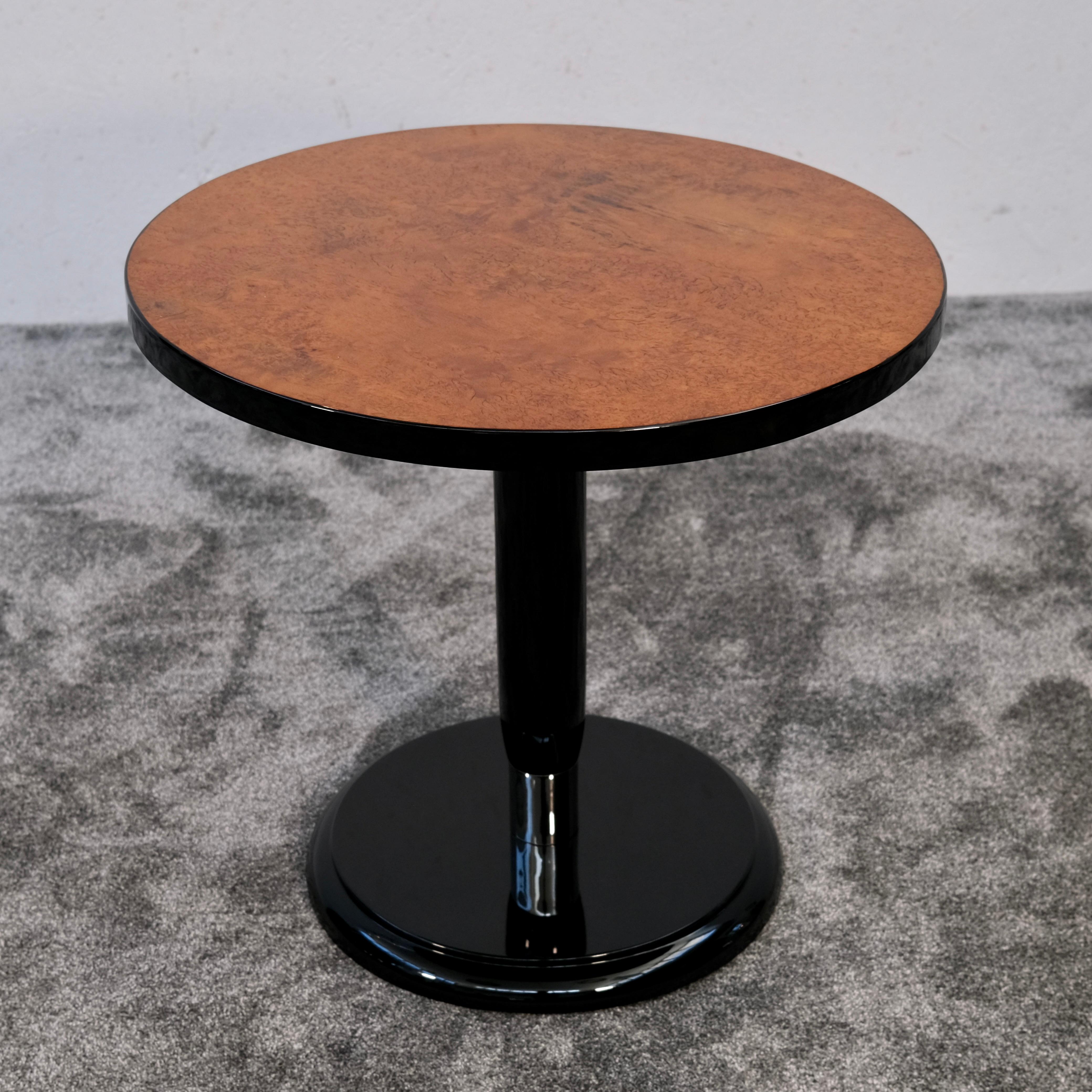 A striking example of authentic Art Deco elegance, this round side table from around 1930 combines refined geometry with luxurious materials. Its clean silhouette and rich surface textures make it both a functional accent and a sculptural statement