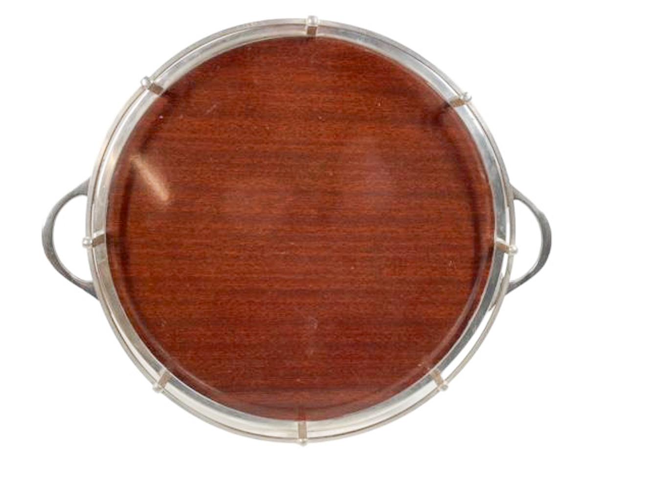 Vintage circular silver plate galleried serving tray with handles and four square legs. The tray surface made of Formica with wood grain surface and provided to Crescent Silver for use in tray surfaces as it was said to be heat, alcohol and water