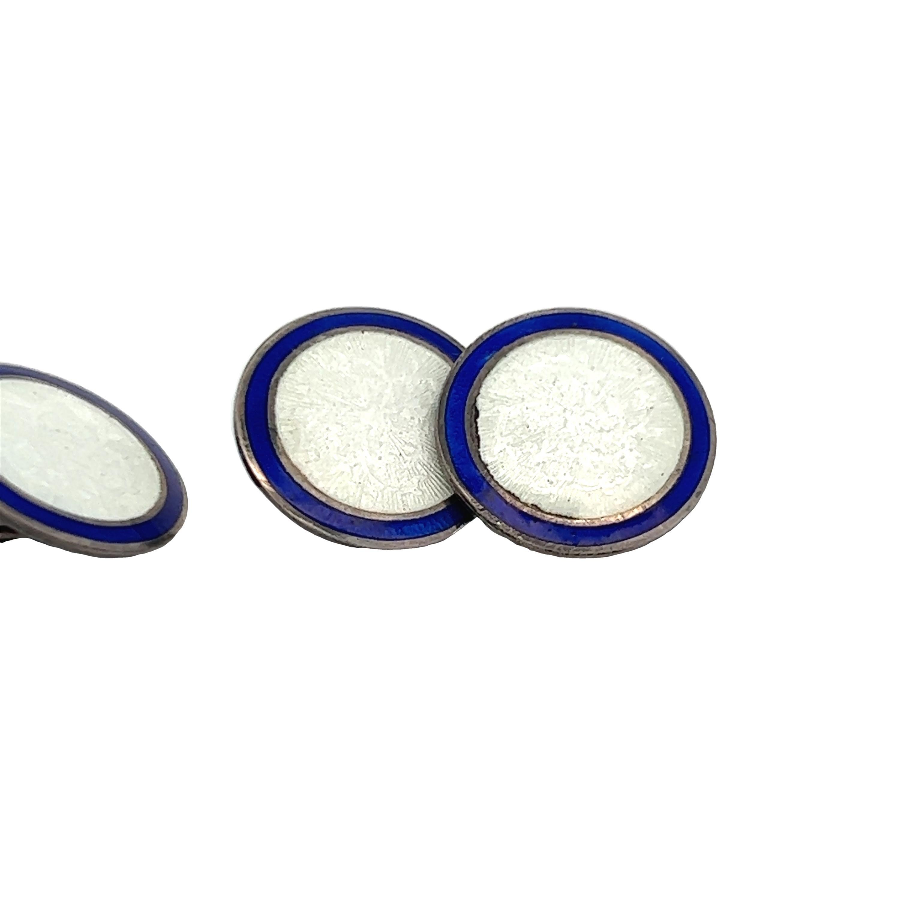 This is a gorgeous set of Sterling Silver 1925 Deco cufflinks that feature a bright and gorgeous white and royal blue enamel. The royal blue frame of the links is exceptional and demands attention, while the bright white harmoniously flows along