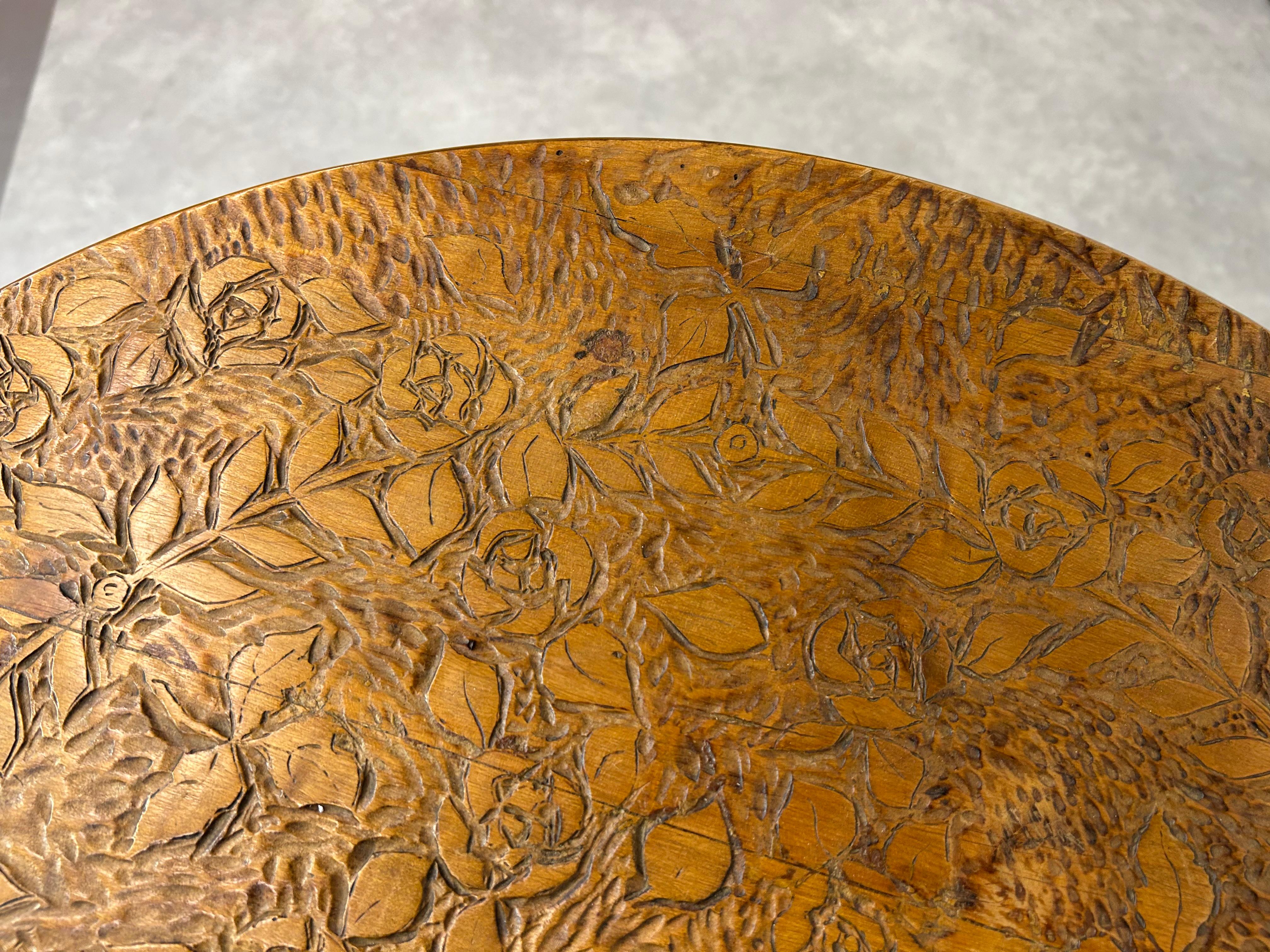 Early 20th Century Round art nouveau coffee table with carved top For Sale