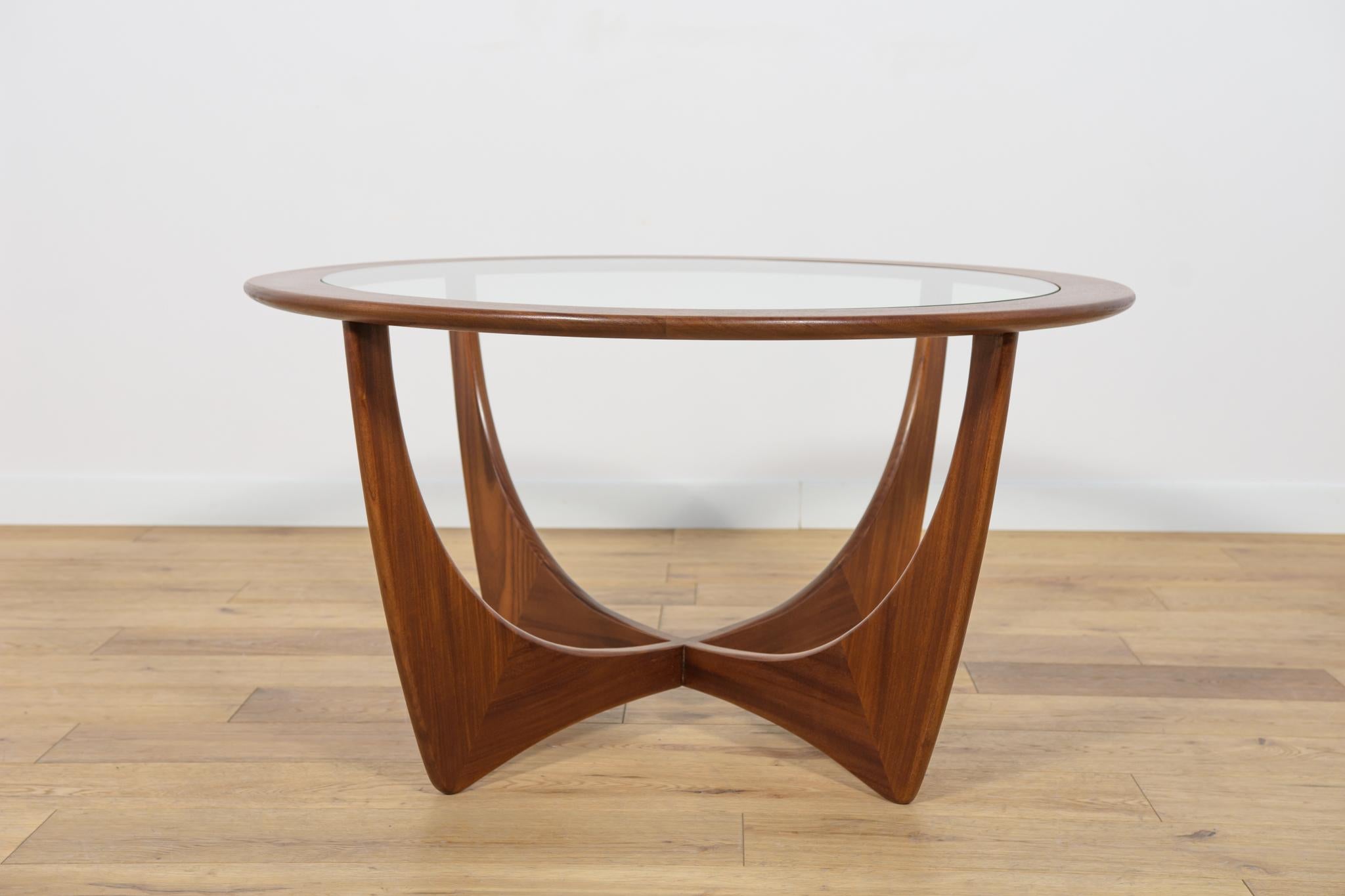 The coffee table was designed by Victor Wilkins for the British manufacturer G-Plan in the 1960s. The solid teak wood has been completely renovated and finished with Danish oil. The glass is tempered, replaced with a new one.