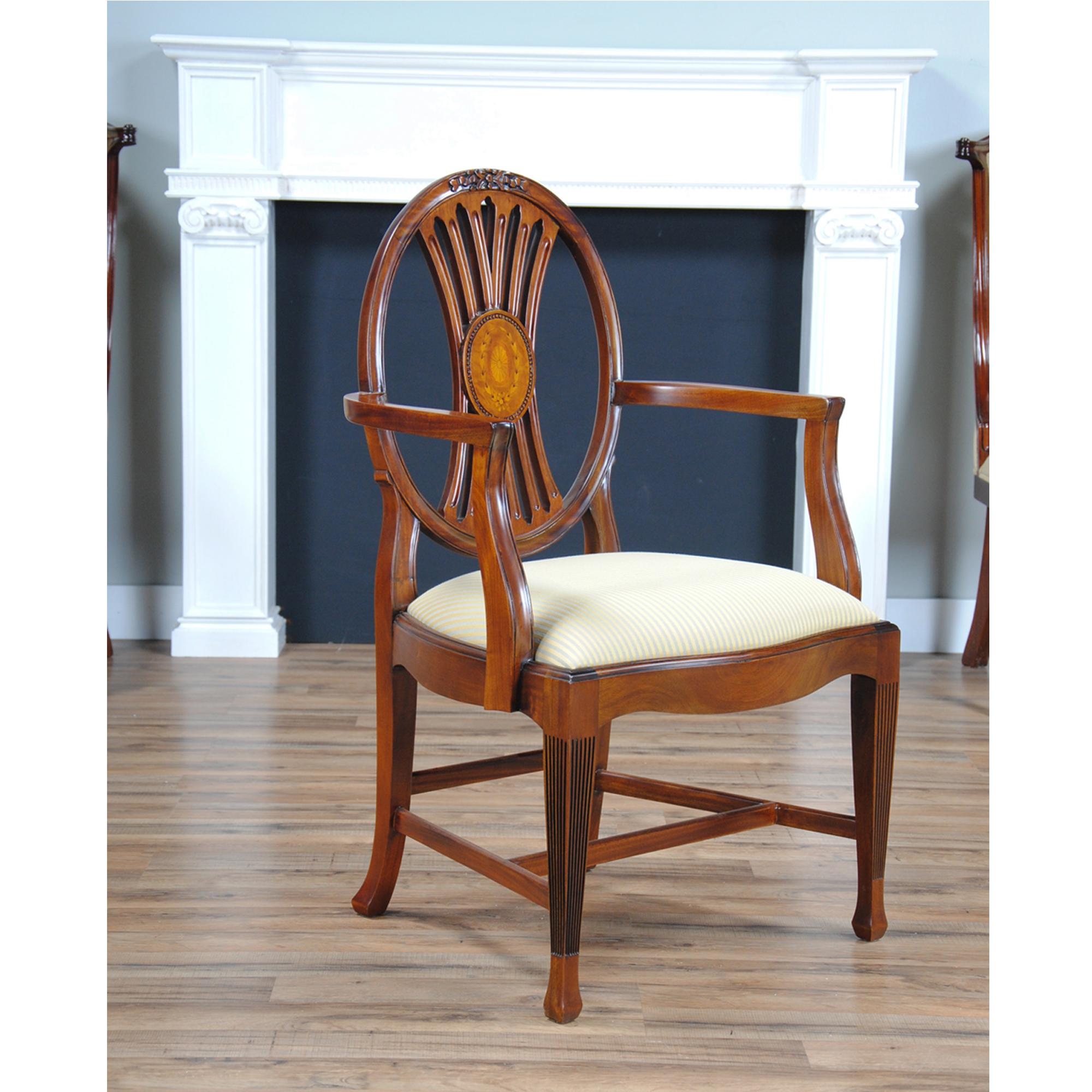 This set of 10 Round Back Inlaid Chairs consists of 2 arm chairs and 8 side chairs. Some of the great design features include high quality workmanship and materials, including beautifully shaped solid mahogany throughout and hand cut veneers in the