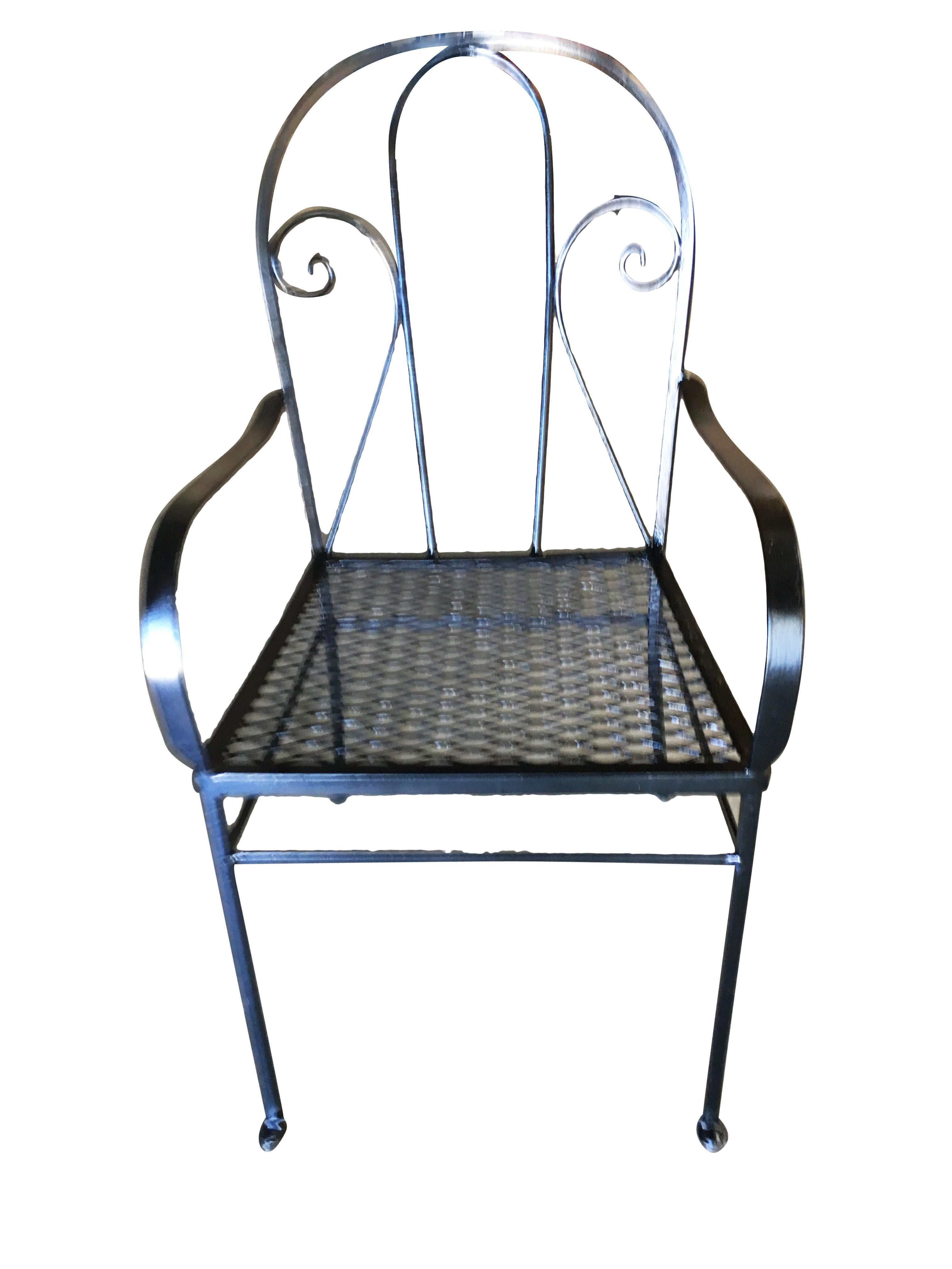Mid-century Iron Bistro outdoor patio chair set that includes two chairs with a distinct scrolling backrest. This set was constructed with solid-core iron castings and is finished in black with a mesh seat. Similar to the patio sets found in Italy