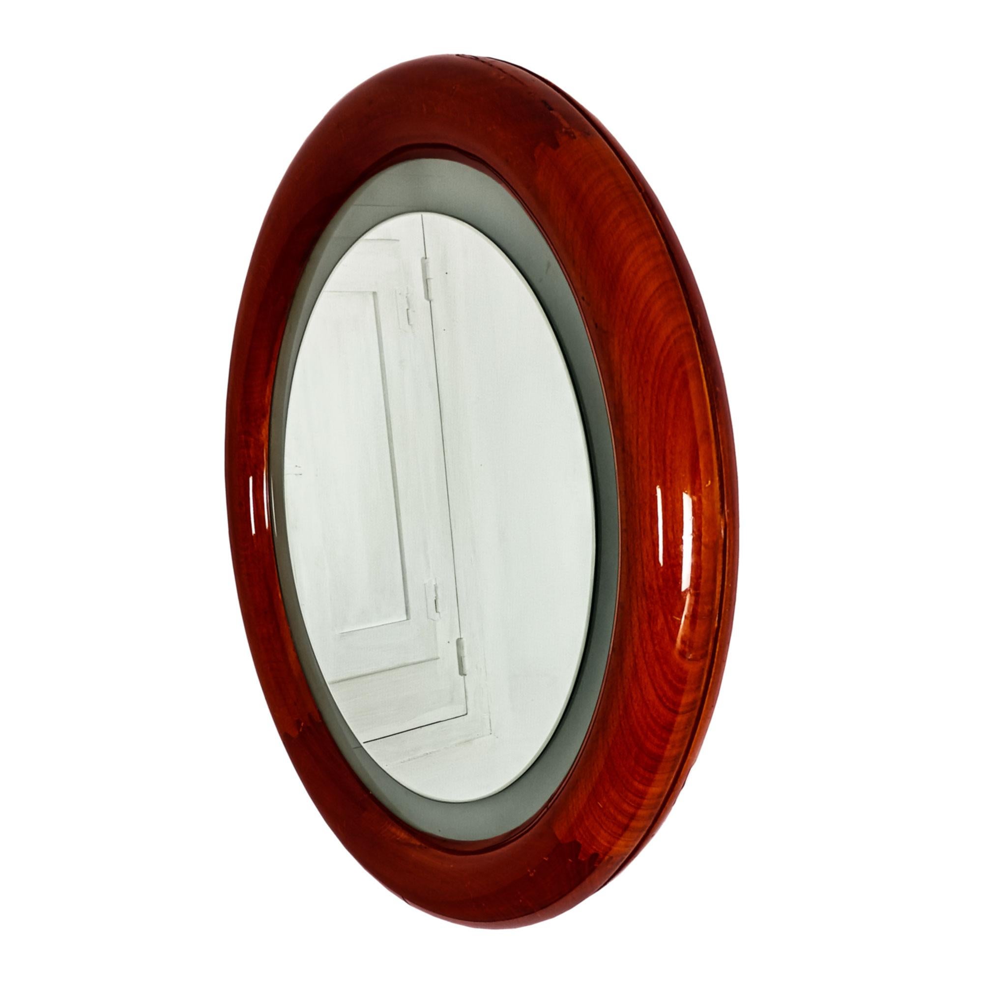 Miroir rond rétro-éclairé en hêtre teinté et verni, verre dépoli et miroir biseauté.

Italie vers 1960