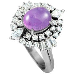 Round, Baguette, and Marquise Diamonds and Sapphire Platinum Ring