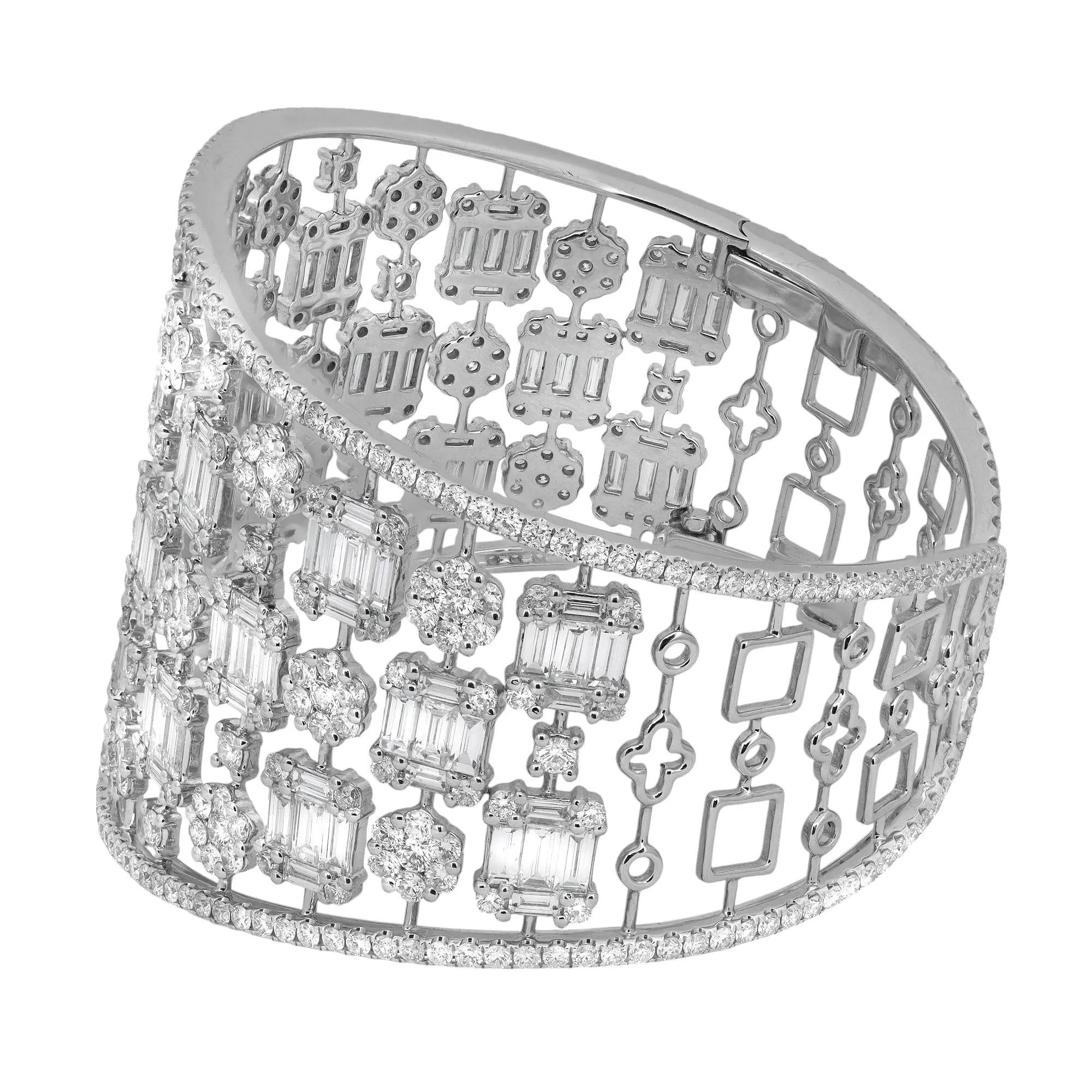 Ti presentiamo un braccialetto bangle con diamanti naturali, audace e chic. Realizzato in oro bianco 18 carati lucidato a specchio. Questo bellissimo pezzo forte è caratterizzato da diamanti naturali tagliati a baguette e rotondi tempestati in un