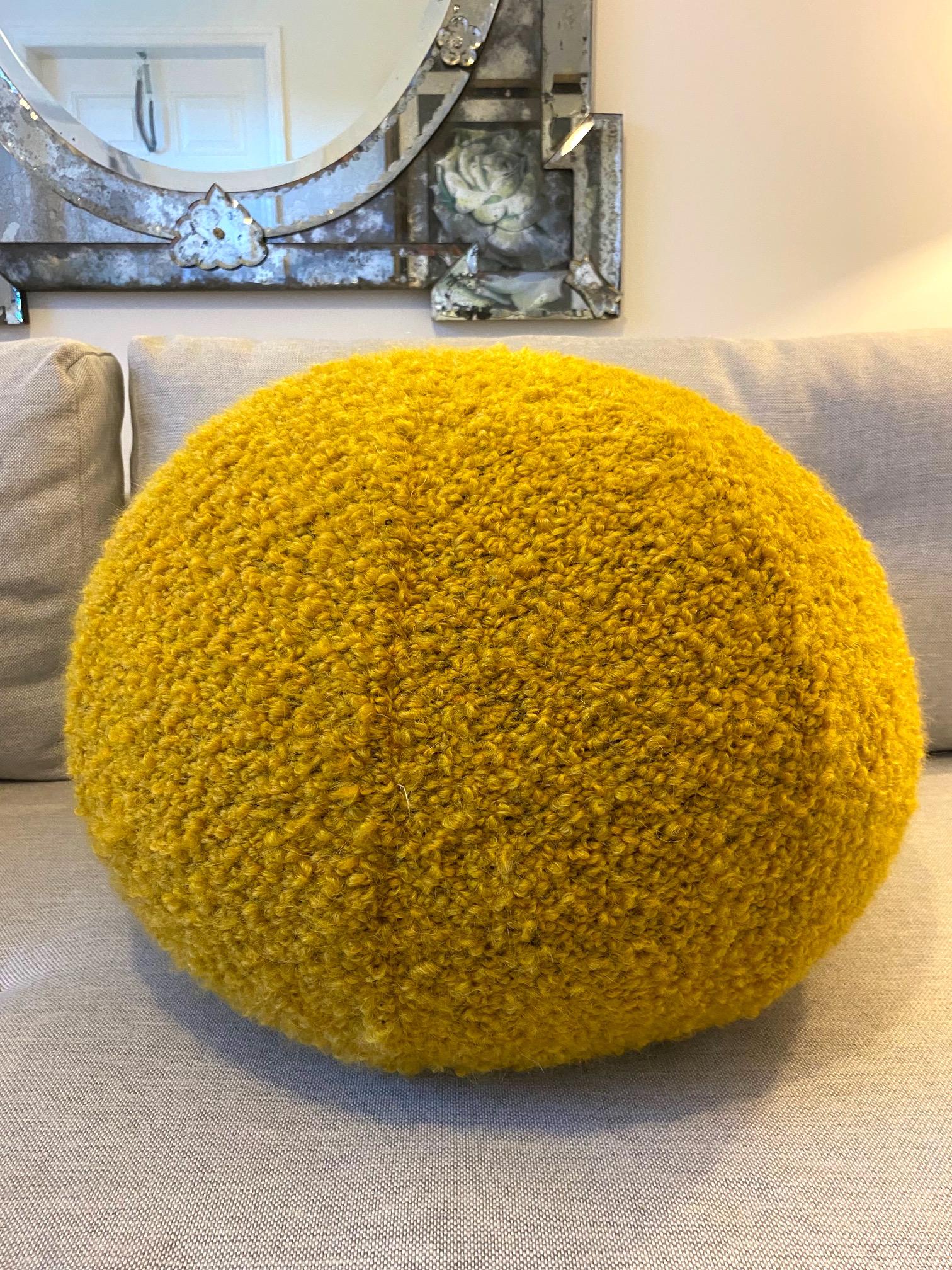 Large round ball pillow handcrafted in Pierre Frey's OPIO fabric by Fadini Borghi. This luxurious accent piece is comprised of woven wool with mohair and alpaca in a vibrant amber yellow bouclé. Stunning in any setting and can be used on seating,