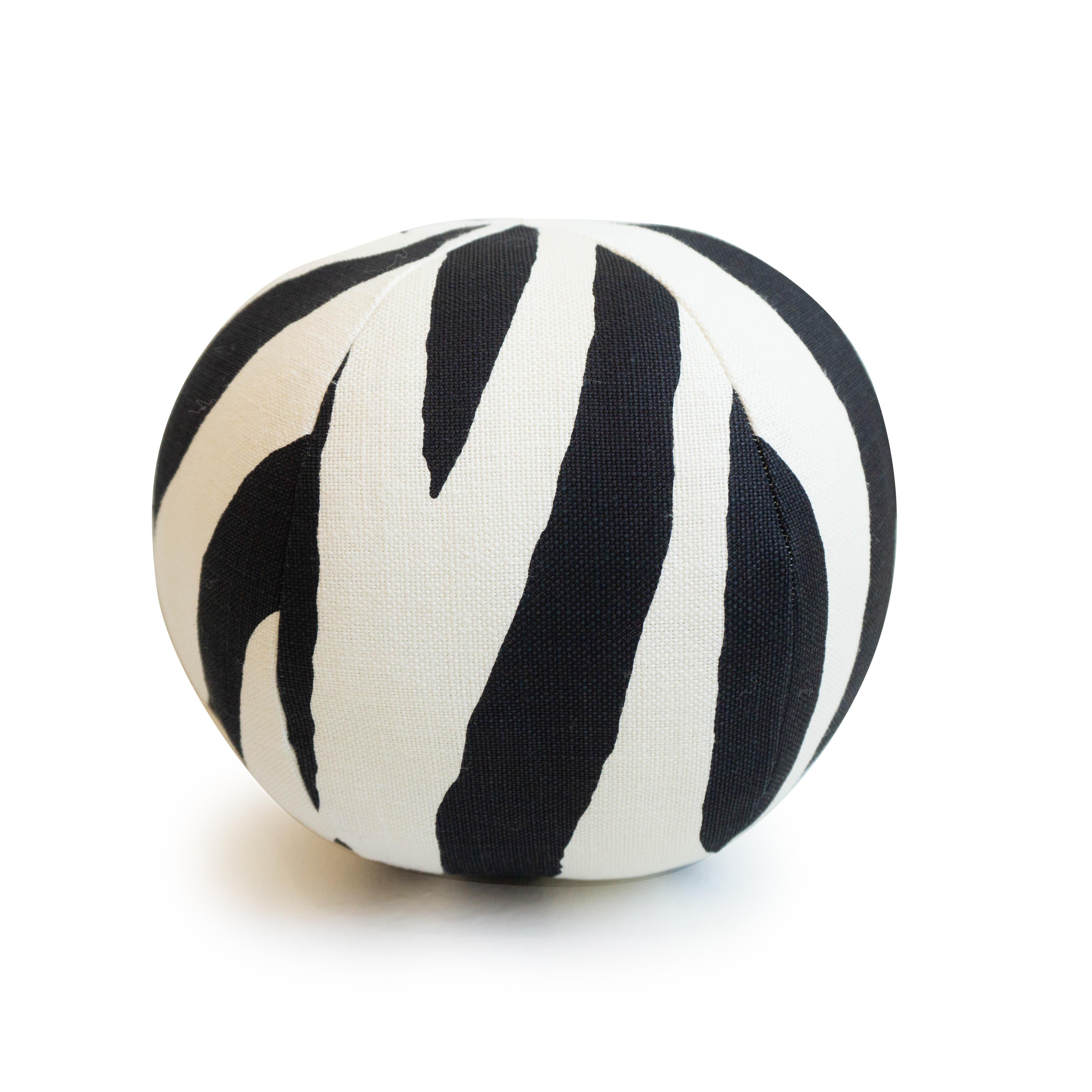 A handmade round ball throw pillow in a zebra print fabric. All pillows are hand sewn in our studio in Norwalk, Connecticut. 

Measurements: 10