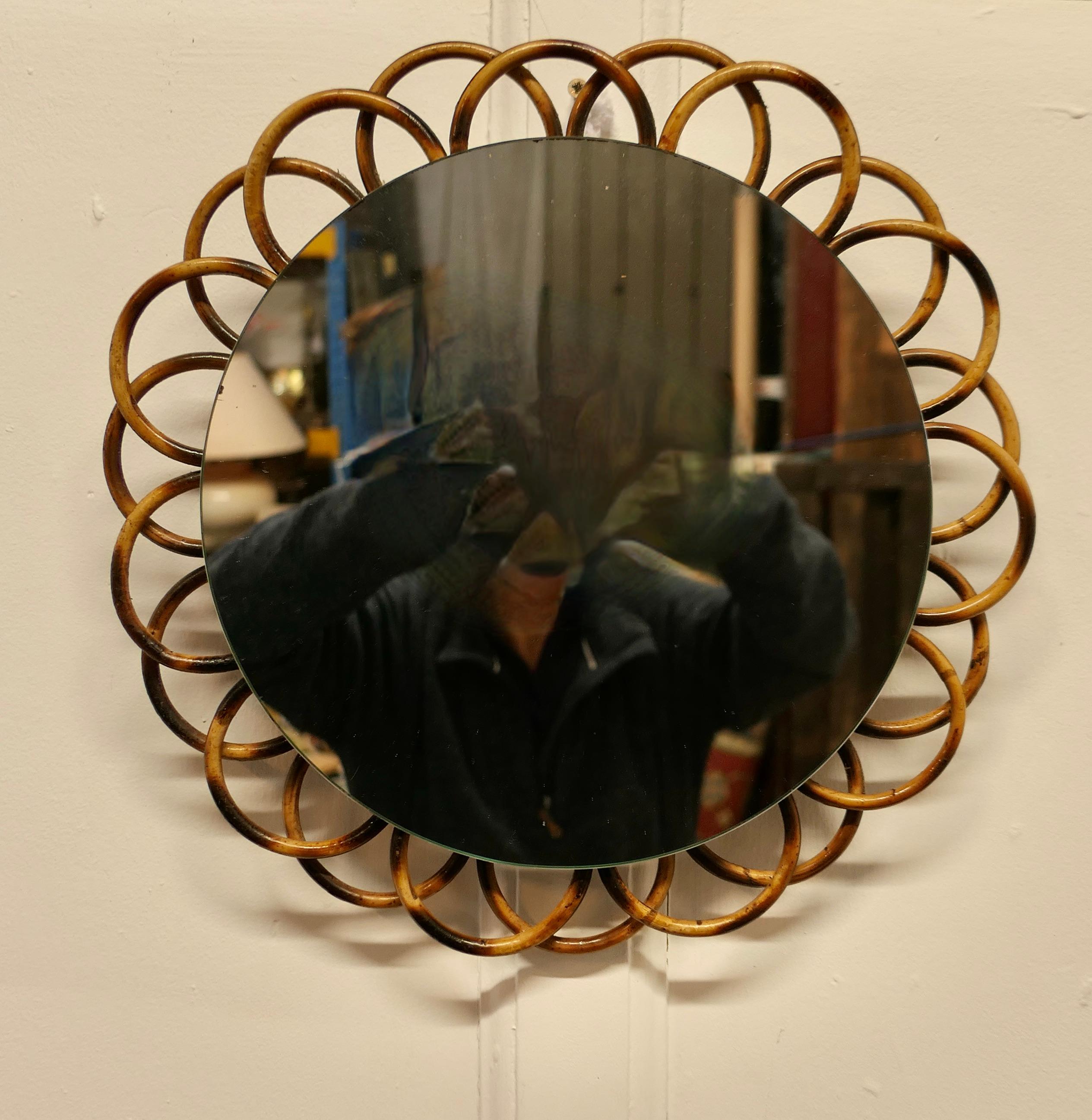 Round Bamboo Wall Mirror 


This is an attractive Mirror it has a 2” wide decorative bamboo frame 
The mirror is in good condition  
The mirror is 15” in diameter
TMS261