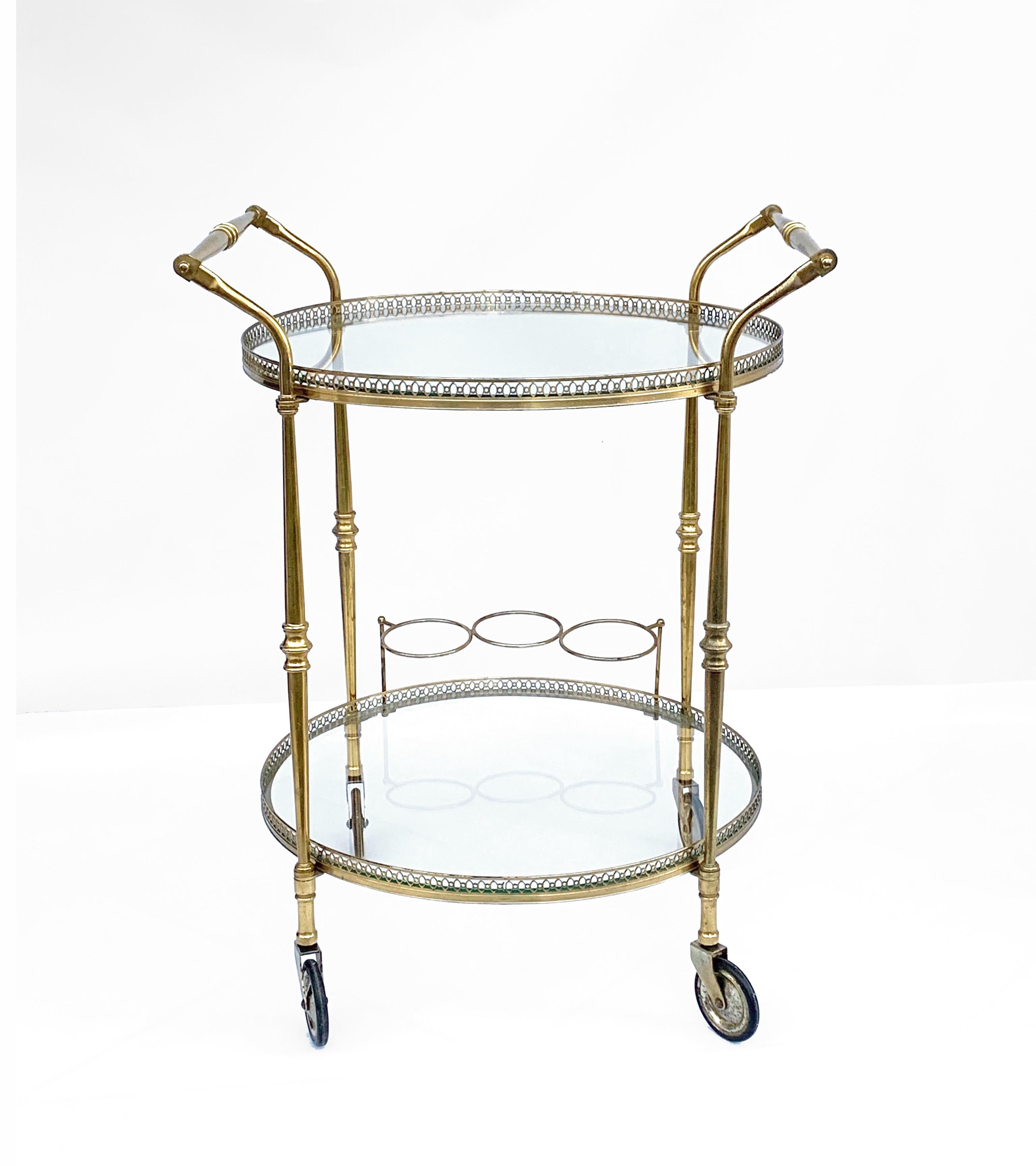 Maison Baguès superb two-level bar trolley. Made of high quality brass and bronze.
With bottle holder.
 