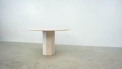 Round Belgian travertine dining table
