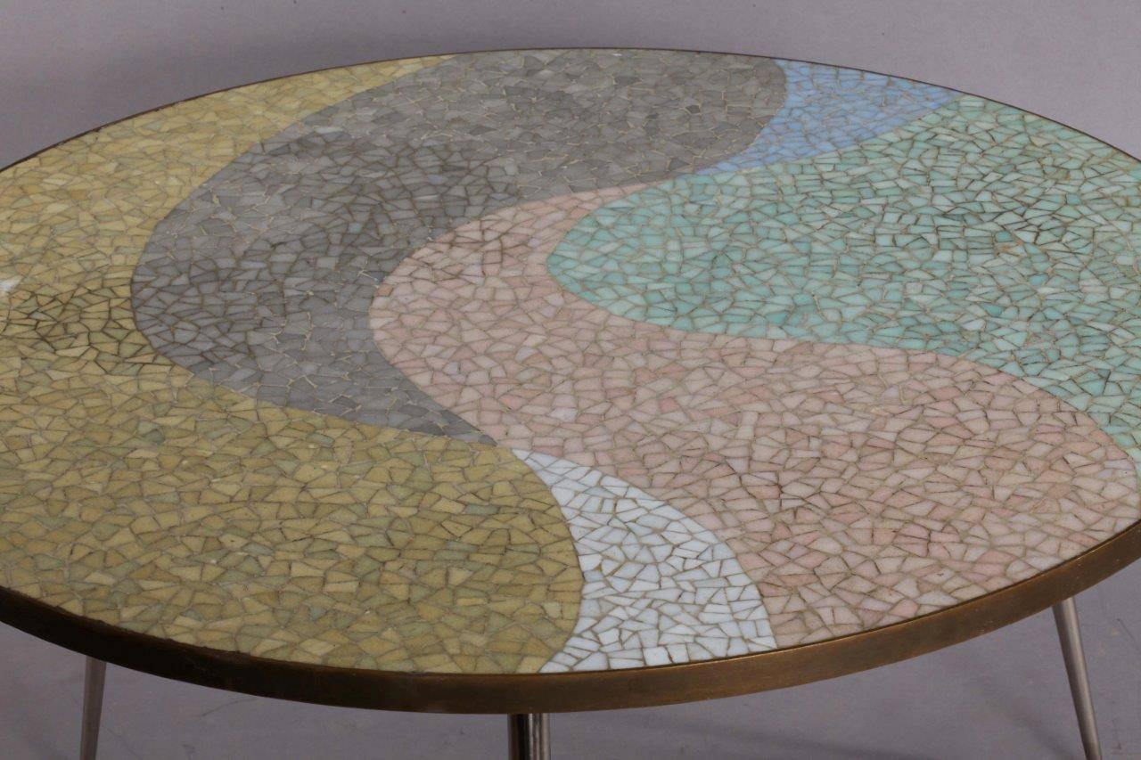 Mosaic coffee table,
Berthold Muller,
Germany, 1950.
Beautiful version of a round Berthold Muller Mosaic table with rare colors and very nice chrome legs and brass frame. No chips!
    