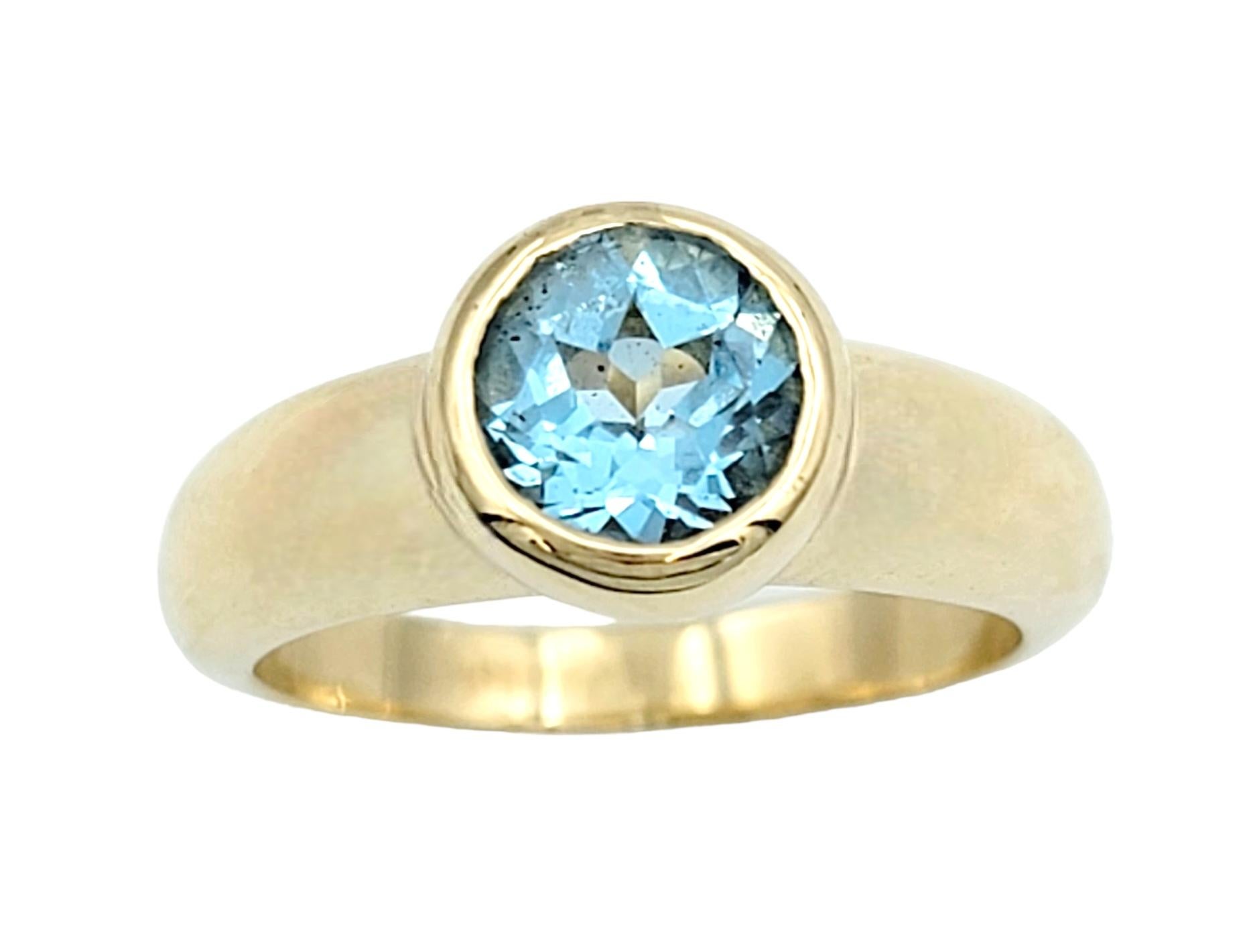 Ring Size: 6

Sleek and contemporary blue topaz solitaire ring in lustrous 14 karat yellow gold. This exquisite piece of jewelry embodies both elegance and modernity, making it the perfect accessory for any occasion.

At the heart of this ring lies