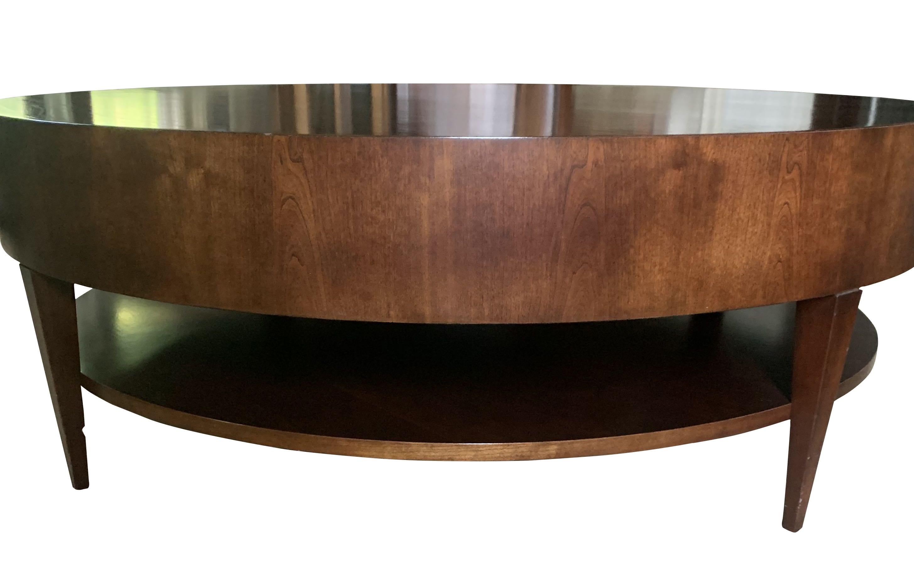 United States 1980s round birch wood coffee table.
This coffee table has two tiers.
The thick top tier is a solid round block of wood.
It is simple and elegant in design.


 