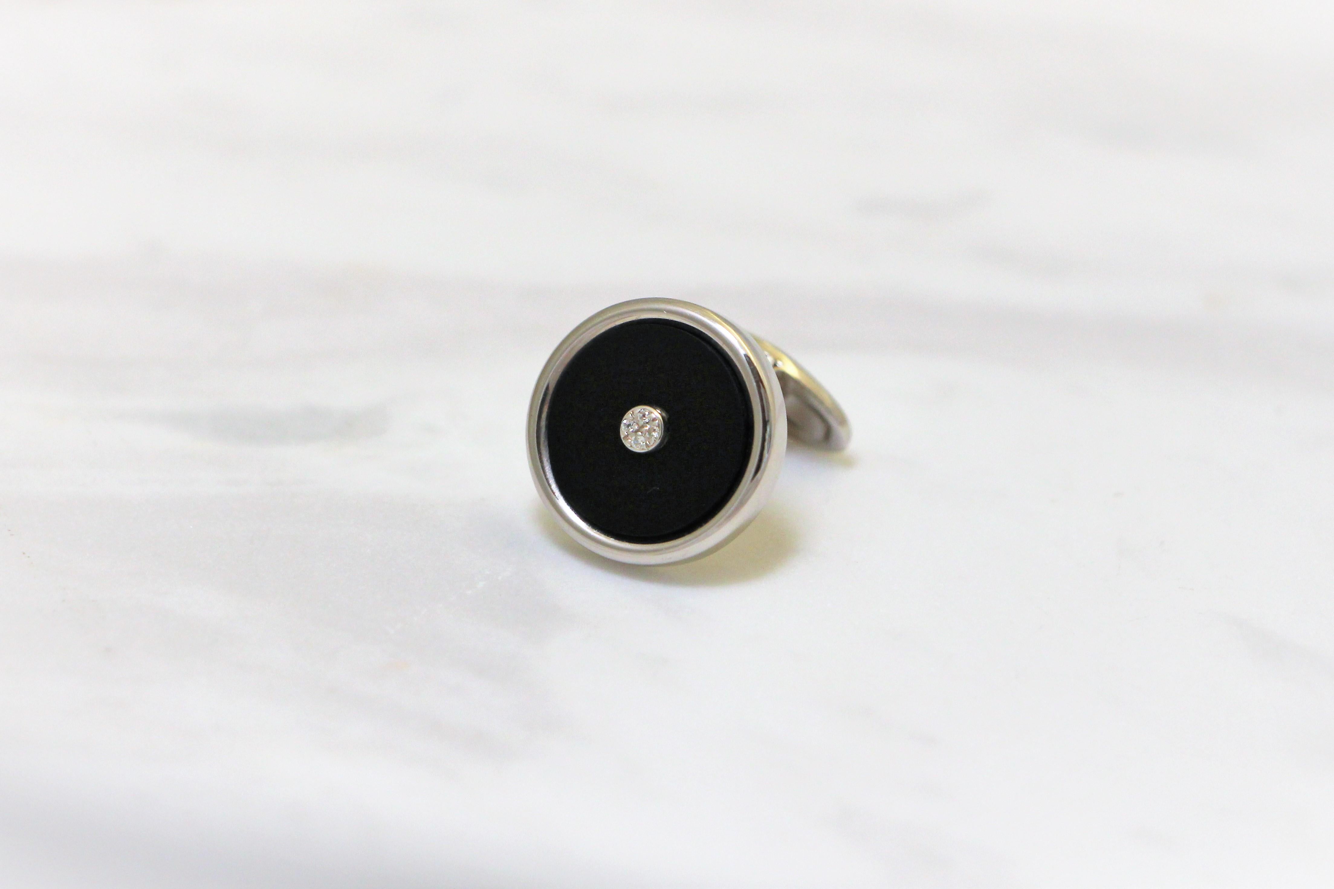 Round cufflinks handcrafted in 14Kt white gold, featuring black onyx and Pave diamonds centre. There is no shape more complete and more eternal, than a circle. These Cufflinks are a  modern vision of elegance. They belong to Metalloplasies