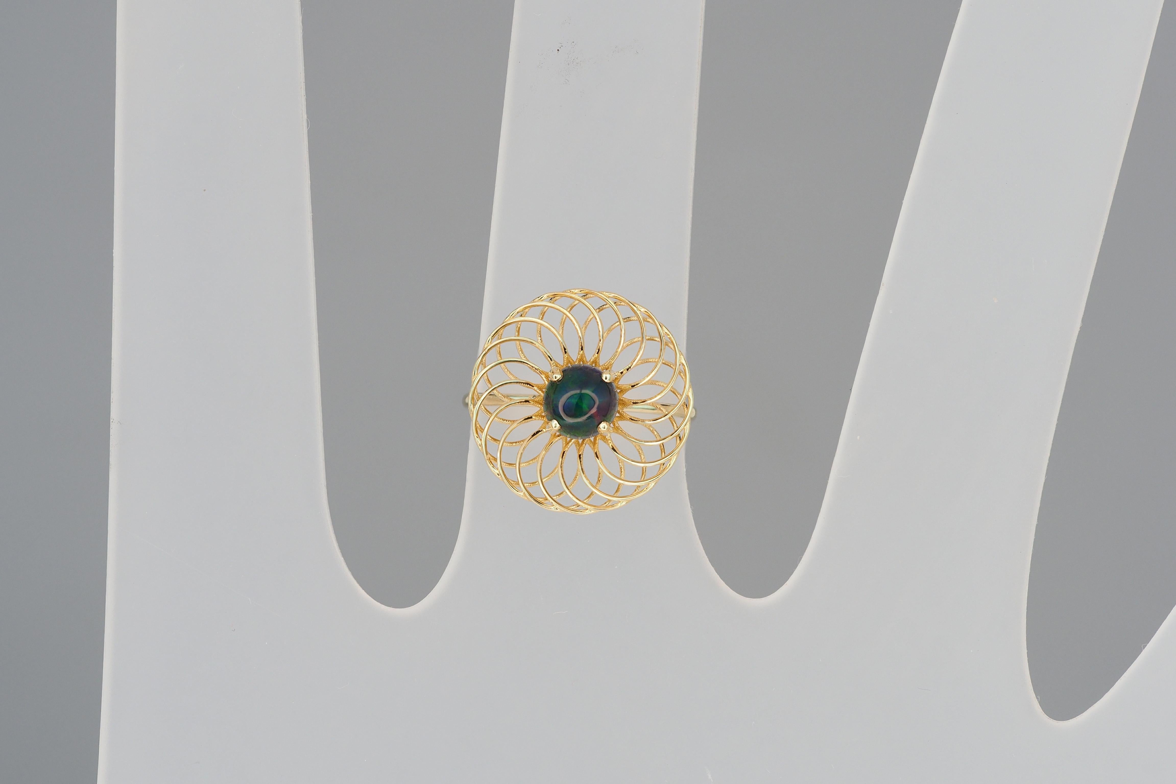 Modern Round black opal ring in 14k gold.
