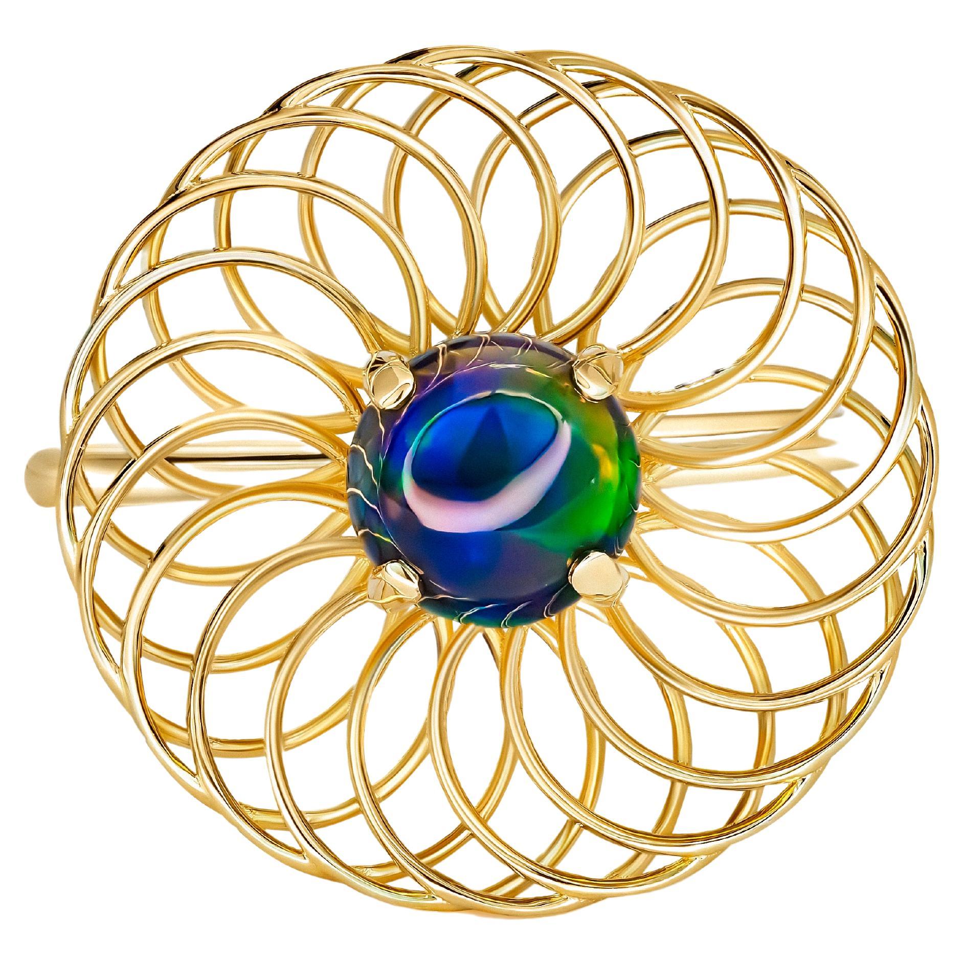 Round black opal ring in 14k gold.