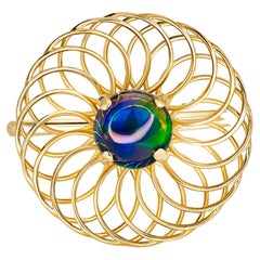 Round black opal ring in 14k gold. 