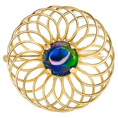 Round black opal ring in 14k gold.