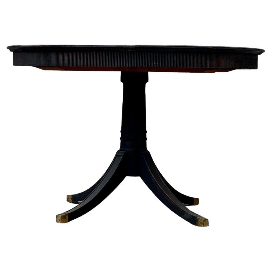 Early Swedish 20th Century Pedestal Dining Table in Black Paint. 
This round table has beautiful Gustavian ribbed details with a border going around the table edge.