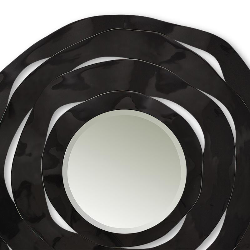 Mirror round black ribbon handcrafted mirror made 
with four carved wood shaving circled surrounded a 
round mirror glass. Made with solid wood. Wall-mounted 
French cleat system for hanging.



 