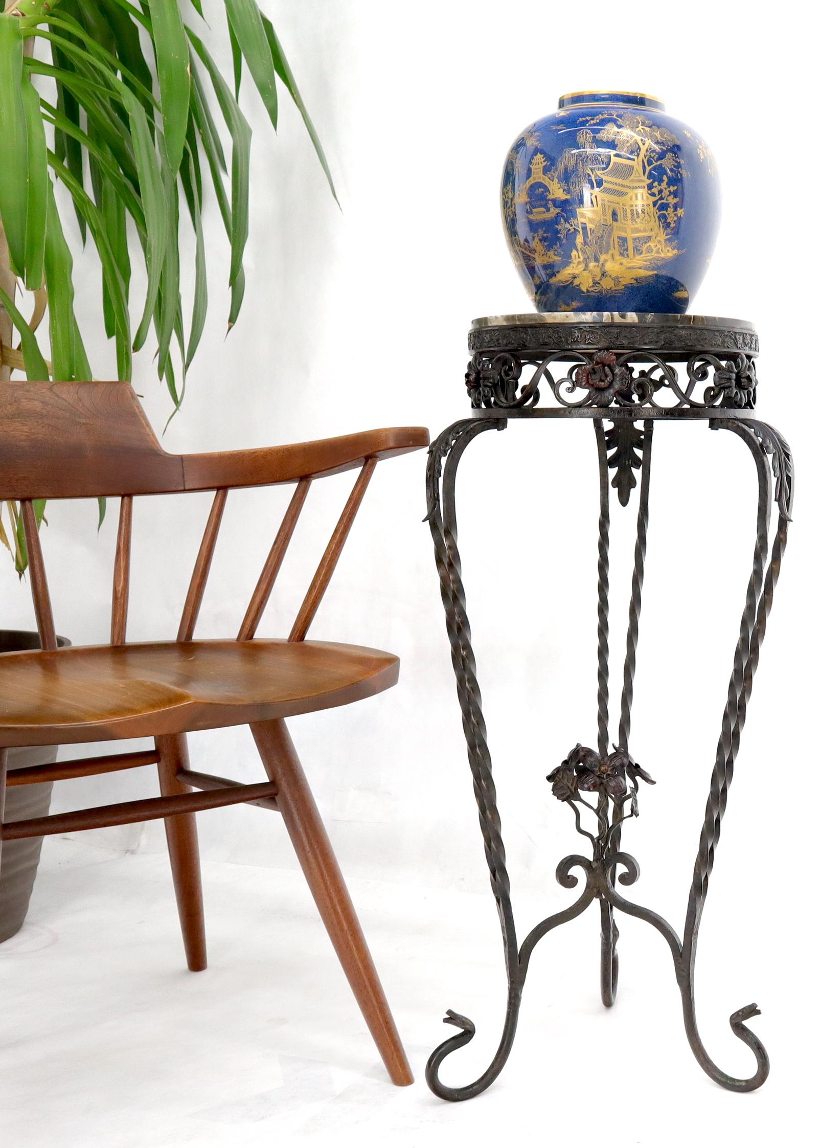 Decorative wrought iron marble top pedestal stand. Marble top diameter is 11