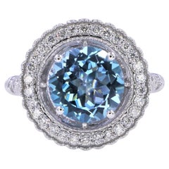 Ring aus 14 Karat Weißgold mit rundem blauem Aquamarin und Diamant-Pavé-Sonnenstrahl-Blumen Halo