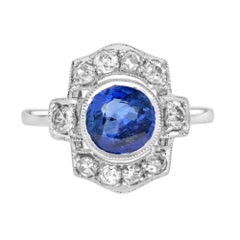 Anillo de oro blanco de 18 quilates con halo redondo de zafiro azul de Ceilán y diamantes inspirado en el Art Decó