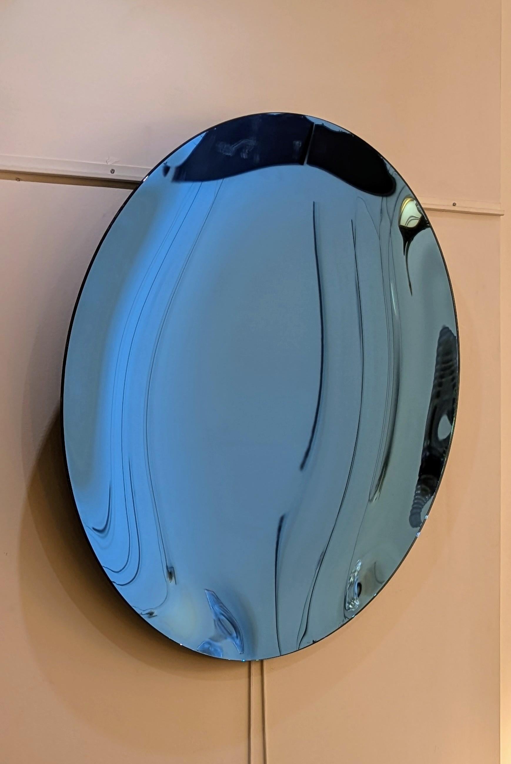 Round blue concave mirror, in perfect condition