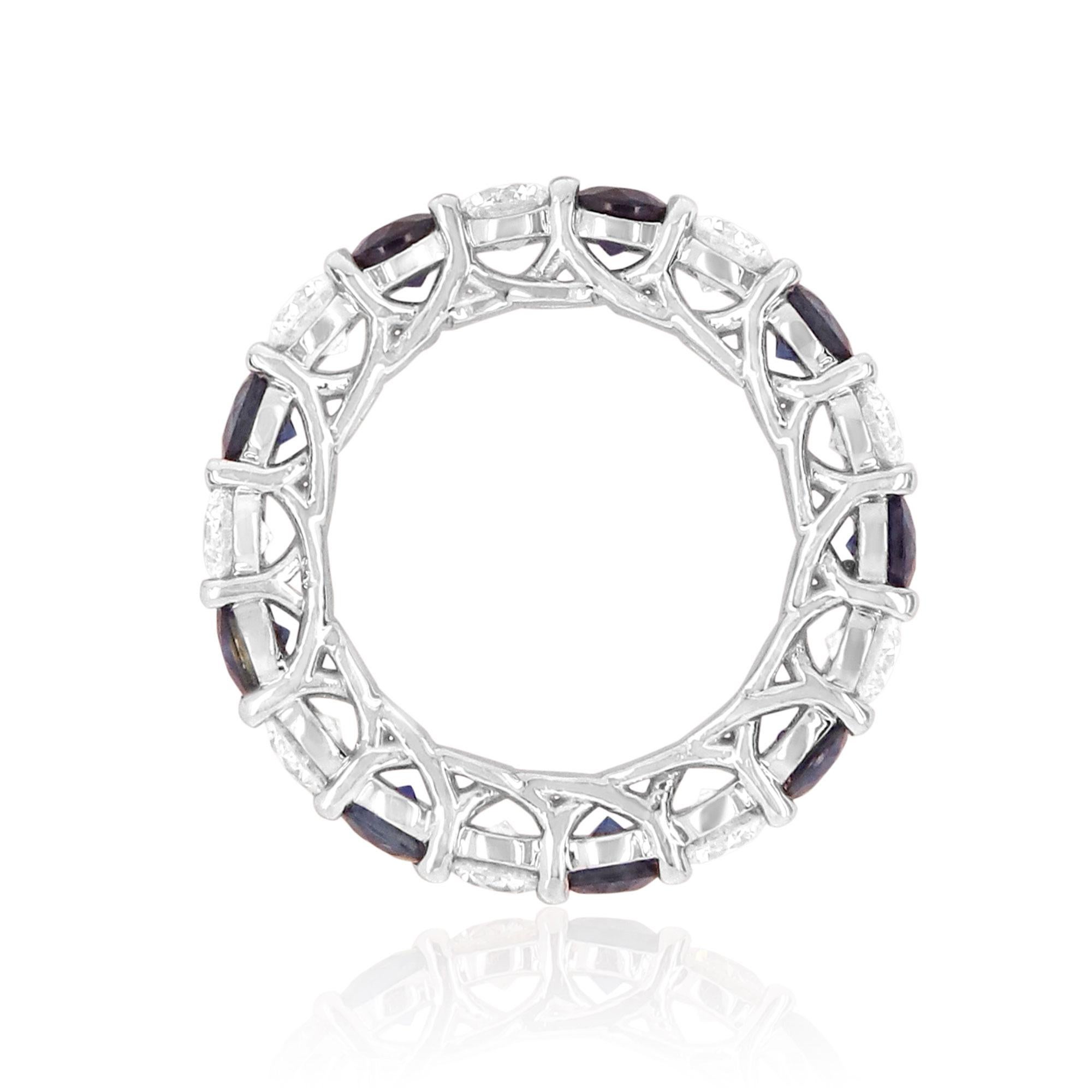 Material: 18k White Gold
Gemstones: 9 Round Blue Sapphires at 3.20 Carats
Diamond Details: 9 Brilliant Round White Diamonds at 2.25 Carats. VS Clarity / H Color. 
Ring Size: 5.75 (cannot be sized)

Fine one-of-a-kind craftsmanship meets incredible