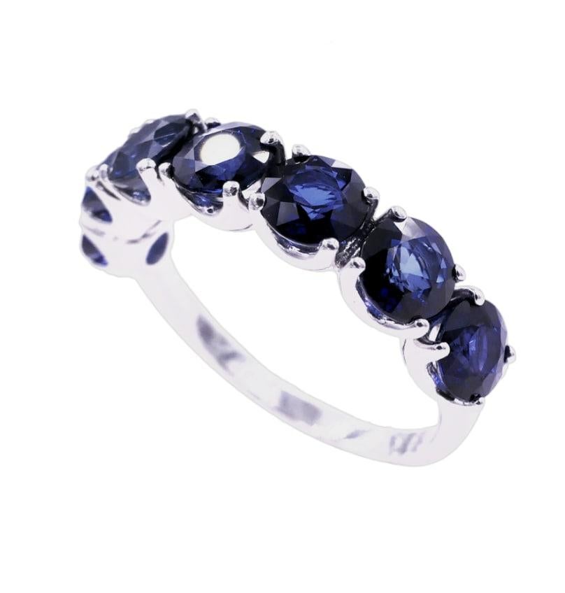 Modern Round Blue Sapphire Eternity Anniversary Wedding Band 14 Karat White Gold Ring For Sale