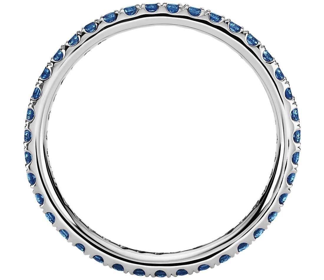 Made to order, please allow 1-2 weeks from date of final design approval by customer. 
Can be made in other sizes and also in other metals or stone colors.
 
A dainty row of brilliant 1.3 mm Blue sapphires are pavé set in this eternity ring crafted