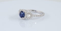 Round Blue Sapphire Three Stone Diamond Halo 18 Karat White Gold Ring