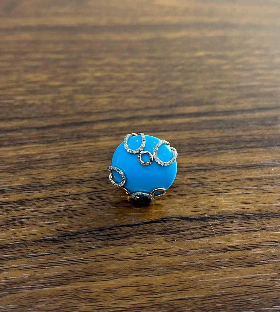 Discover the allure of our exquisite ring, a masterpiece of modern elegance. Crafted with a captivating blue turquoise, this piece radiates a serene charm. The turquoise is beautifully complemented by 0.3 carats of sparkling white diamonds, adding a