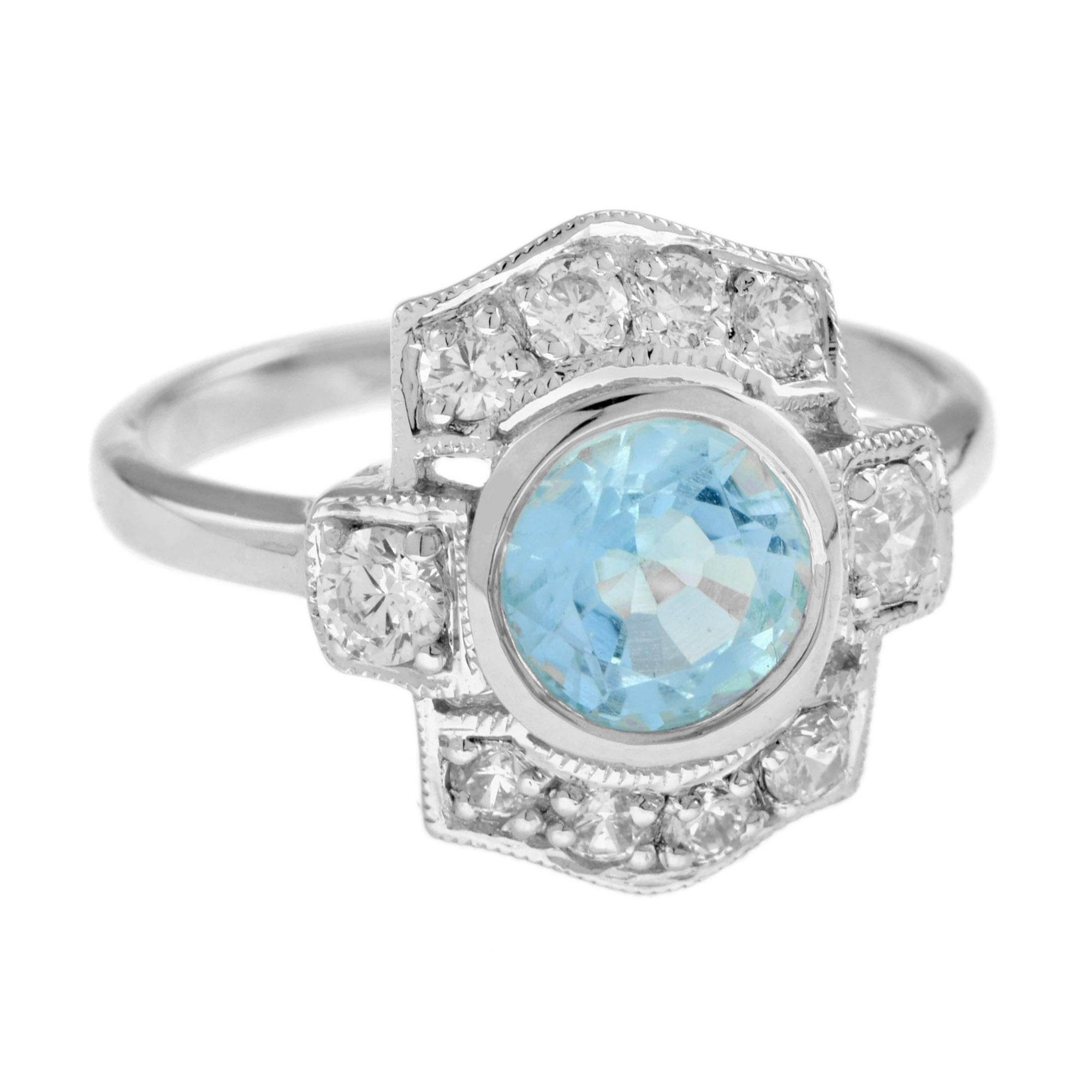 A stunning Art Deco Inspired Blue Topaz and Diamond White Gold Ring! The 2.3 carat cushion shaped blue topaz is bezel set with a milgrain edge sitting atop a balanced dispersion of old cut diamonds that total 0.69 carat. 14K White Gold.
Ring