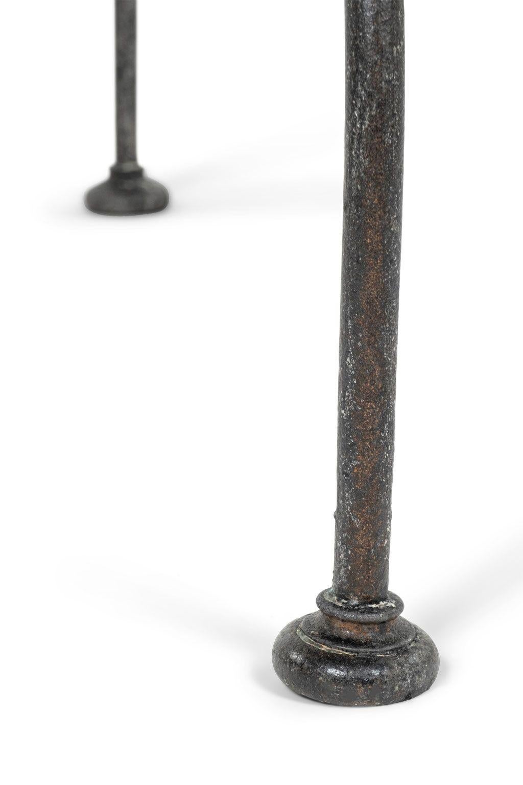 Round bluestone top iron-base center table from France. Three-legged iron table forged circa 1880-1899 with later bluestone top.