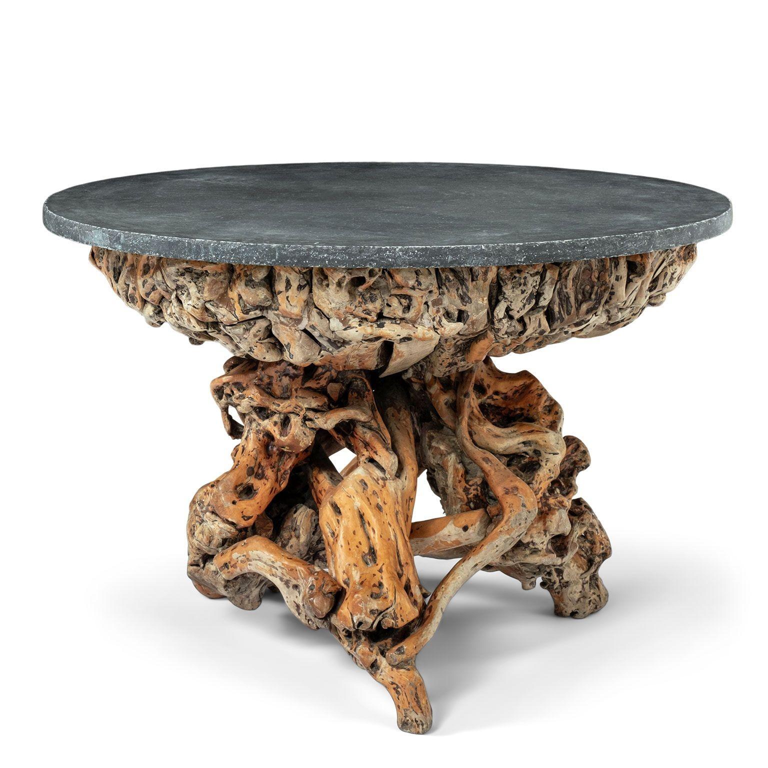 Round large-scale bluestone top root wood base table. Round straight-edge bluestone top raised upon a natural-shaped base of root wood finished in varying shades of brown.

Note: Original/early finish on antique and vintage metal will include some,